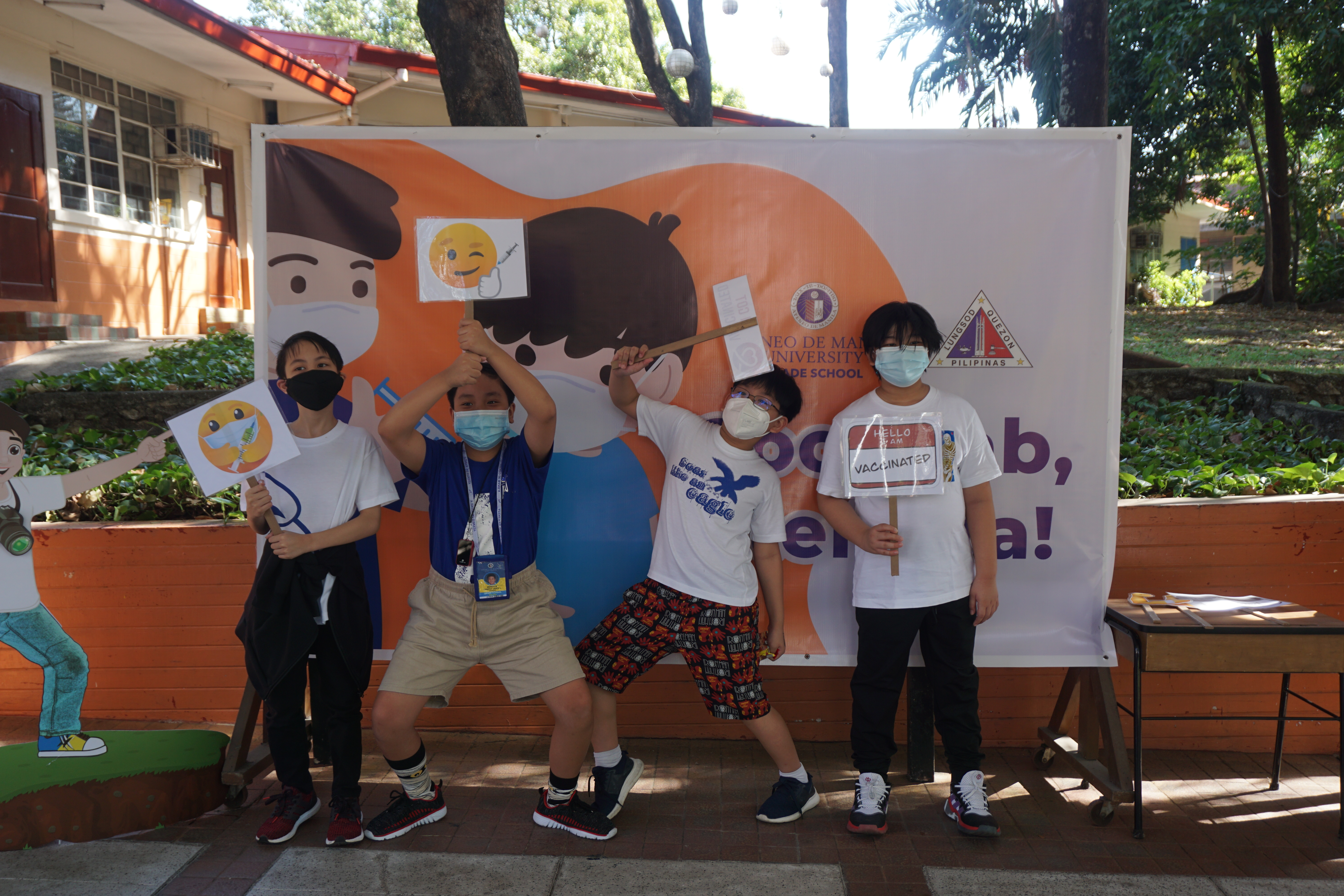 Grade 5 classmates (from left) Enzo, Timmy, Jap and Matt celebrate their vaccinations with a group photo. It's the boys' first time to see one another face-to-face this school year.