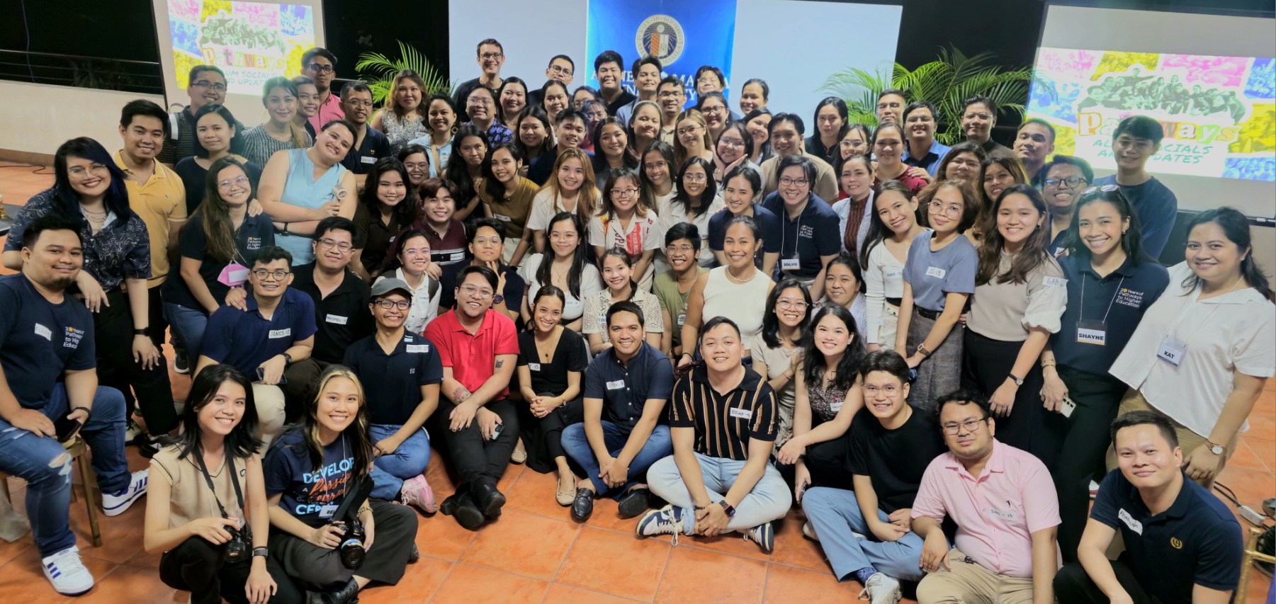Pathways alumni and staff pose for a community photo at the MVP Roofdeck