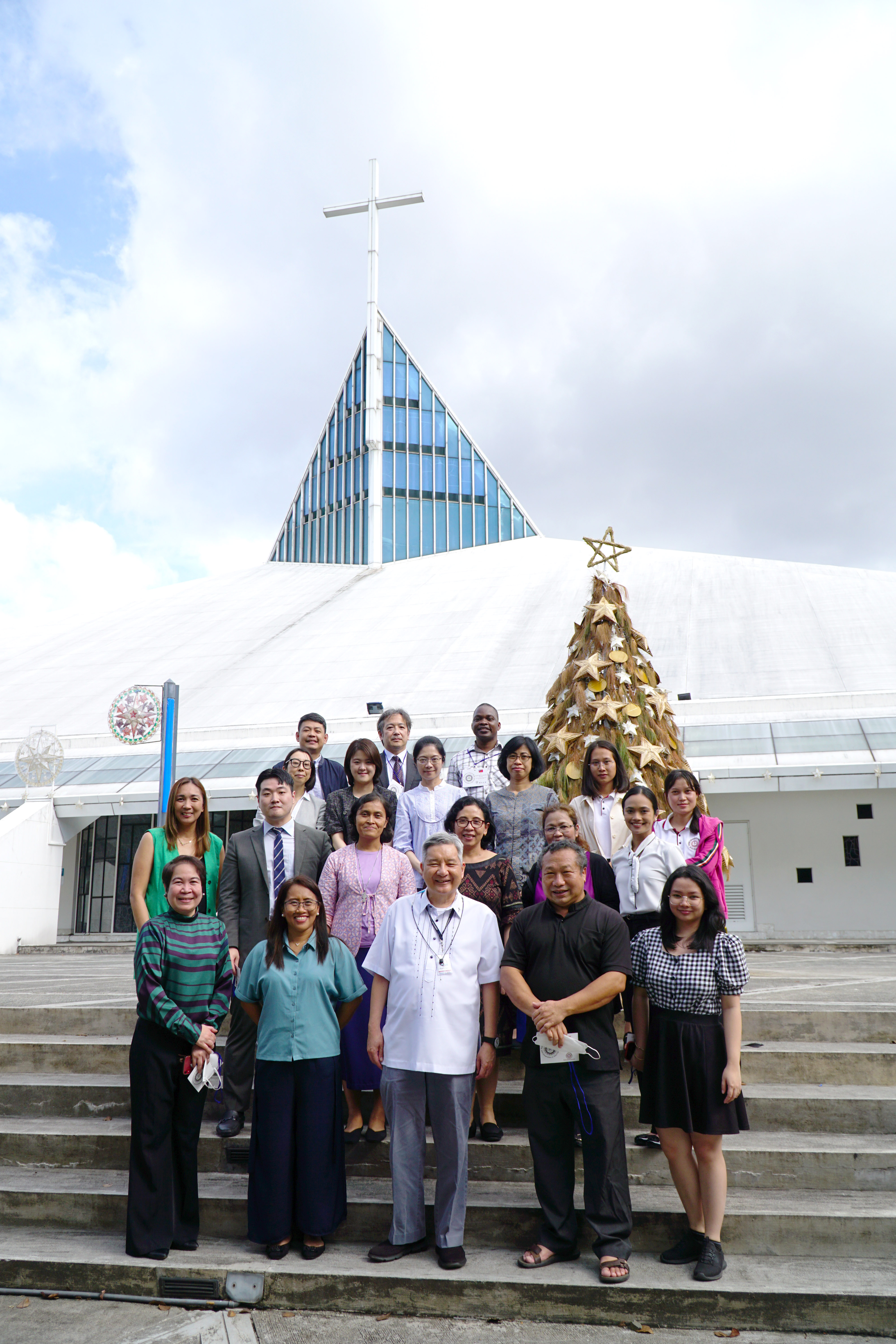 AJCU-AP 2022 INO annual meeting onsite delegates at the Ateneo de Manila University with AJCU-AP president, Fr Roberto Yap SJ, at the Church of the Gesu.
