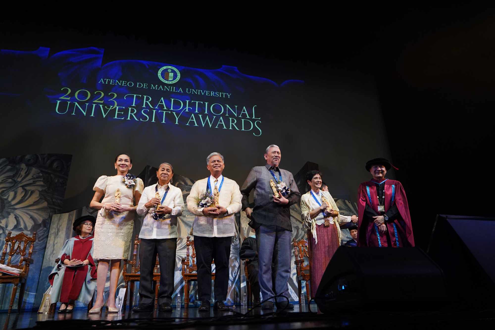 The awardees with Fr Roberto C Yap SJ onstage
