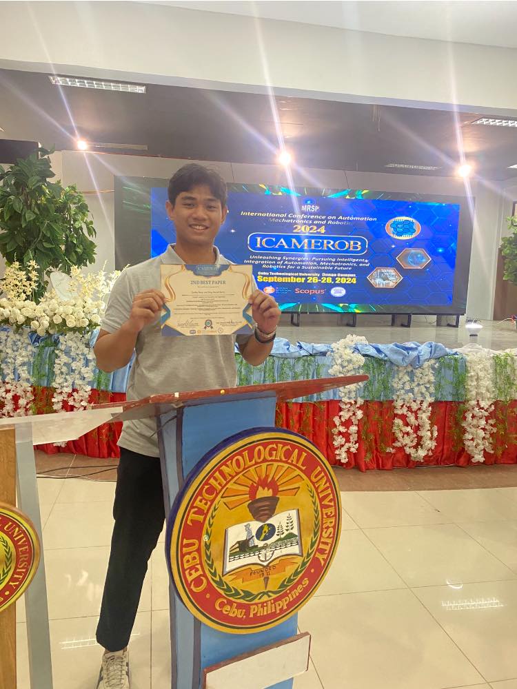 Perez showing his certificate of award