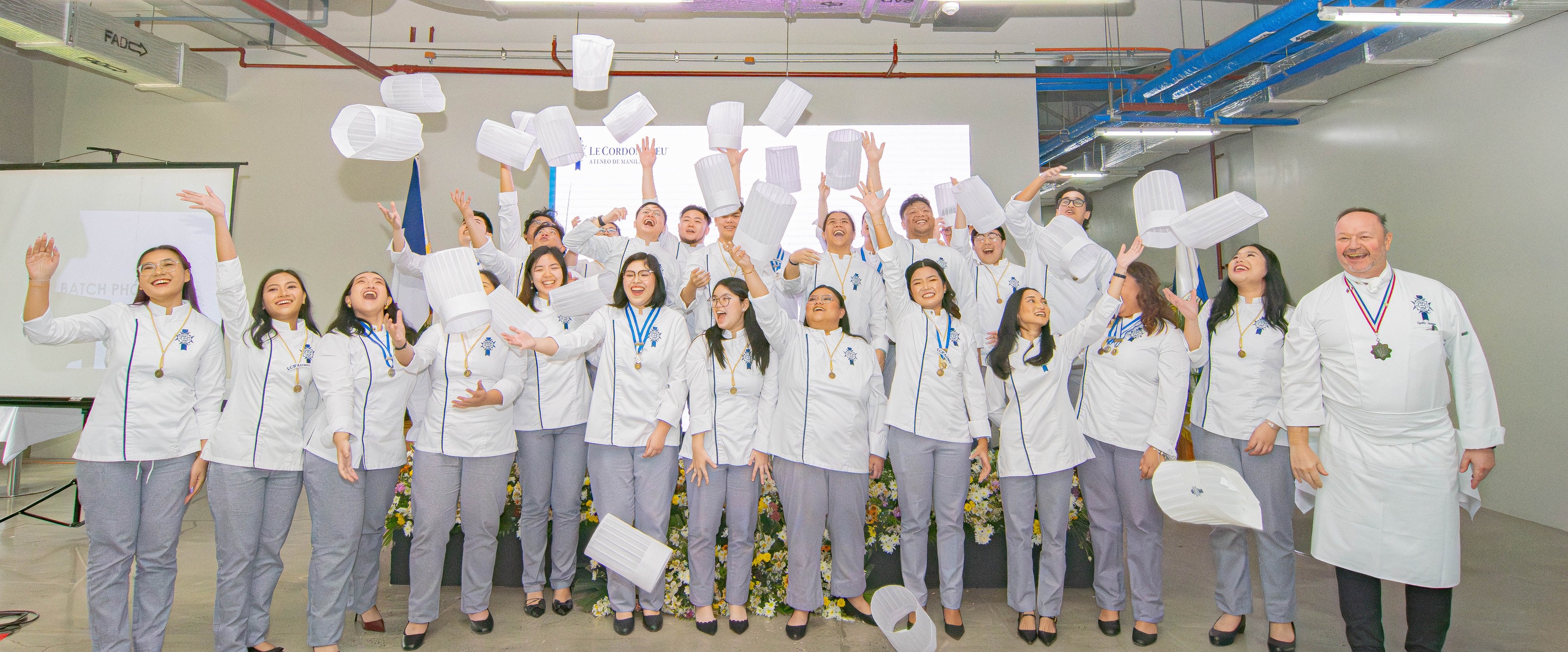 The BS REnt class of 2025 participate in the traditional toque toss