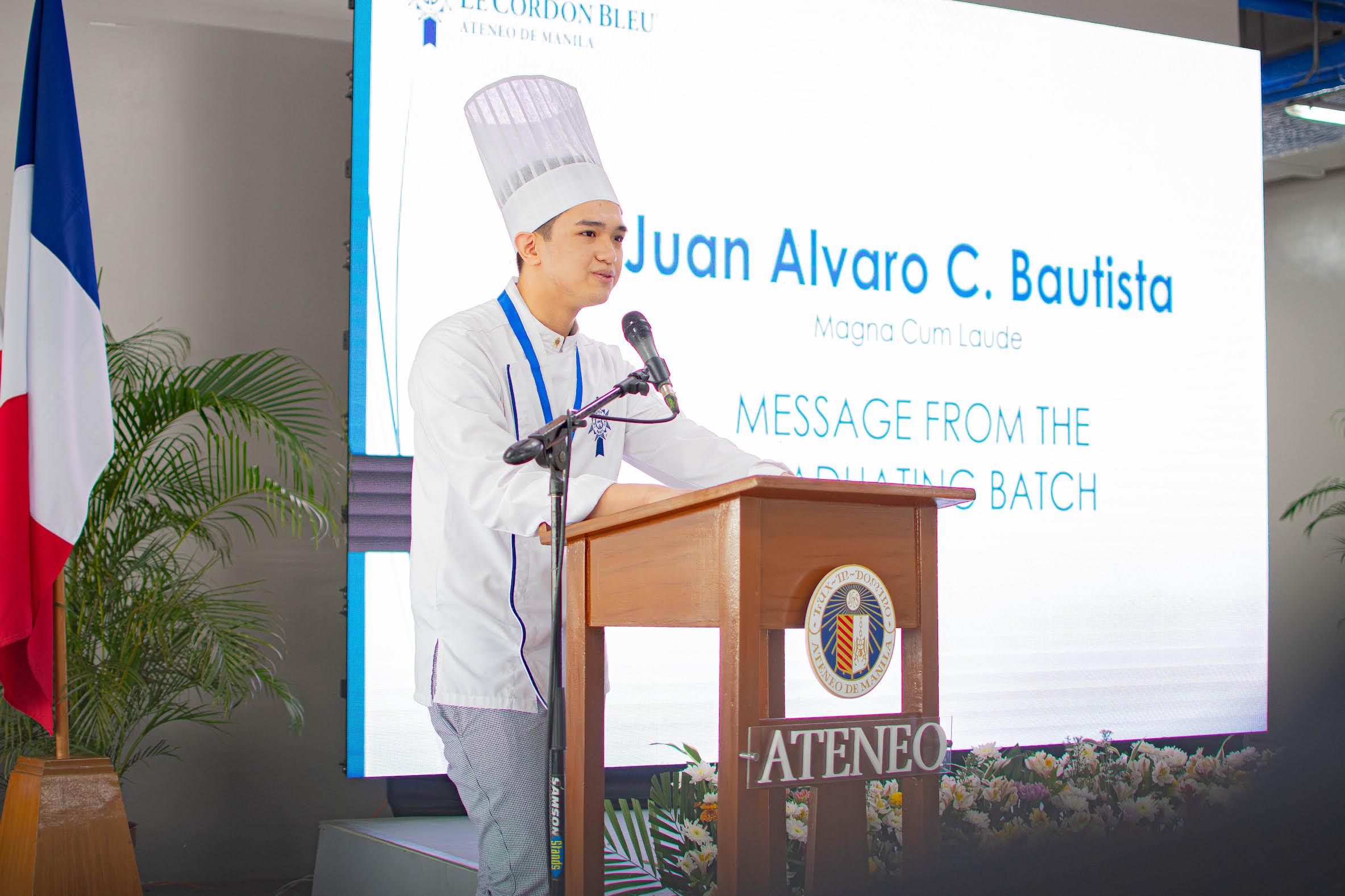 Juan Alvaro C. Bautista delivers a message from the graduating batch