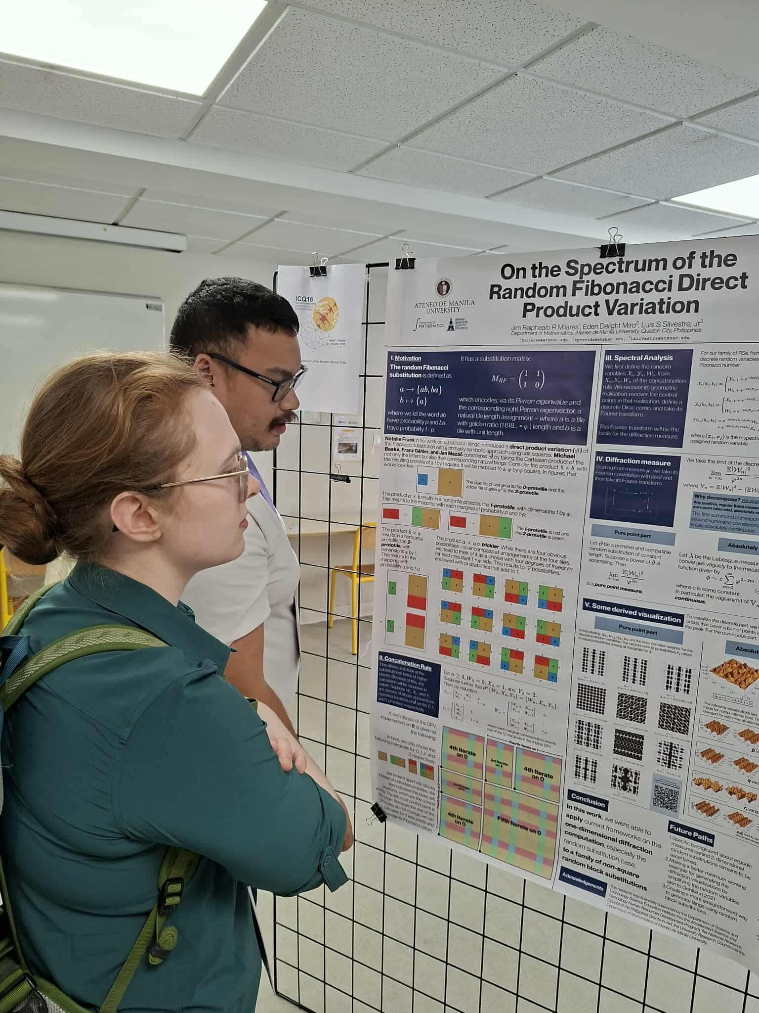 Jim talking to researcher, poster