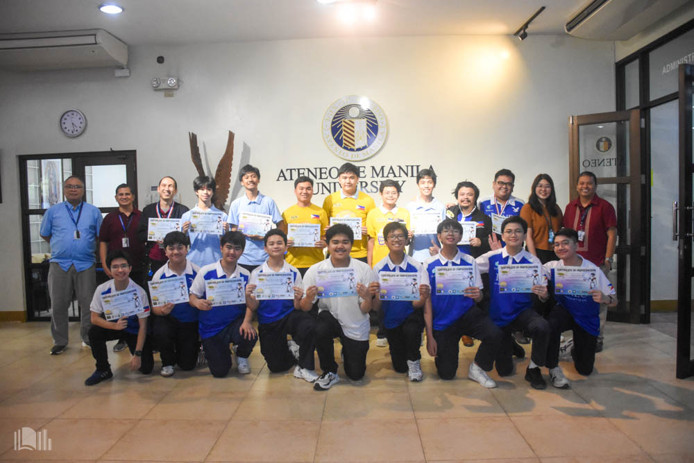 The BluBLOC PRO delegation with coaches and AJHS/ASHS administrators. Front row from left: Sannie Pascua, Gab Asuncion, Gavin Mallari, Daylight Ibay, Aidan Cabaya, Matty Trinidad, Marc Tiongson, Ian Auto, Dylan Lim; back row from left: Fr Jonjee Sumpaico SJ, Jayvee Fabello, Joel Falgui, Ethan Hizon, Nathan Ballatan, Liam Daga, Junby Layaoen, Marcus Crisostomo, Hanns Bumatay, Lavi Subang, Jason Arias, Erika San Jose, Dingdong Guerrero 