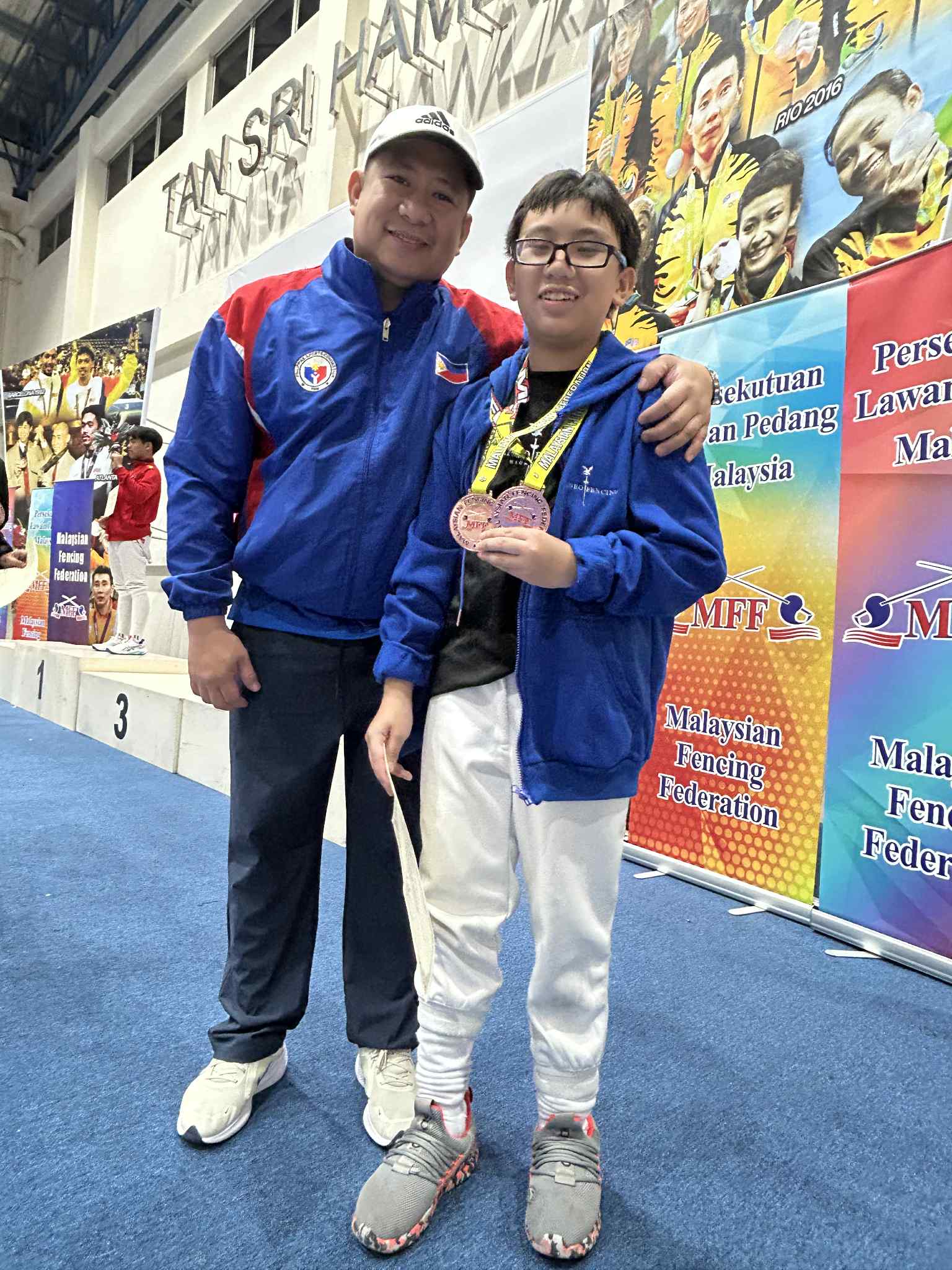 Coach Edward Daliva with Trent Ignacio, who won bronzes for two sabre team events 
