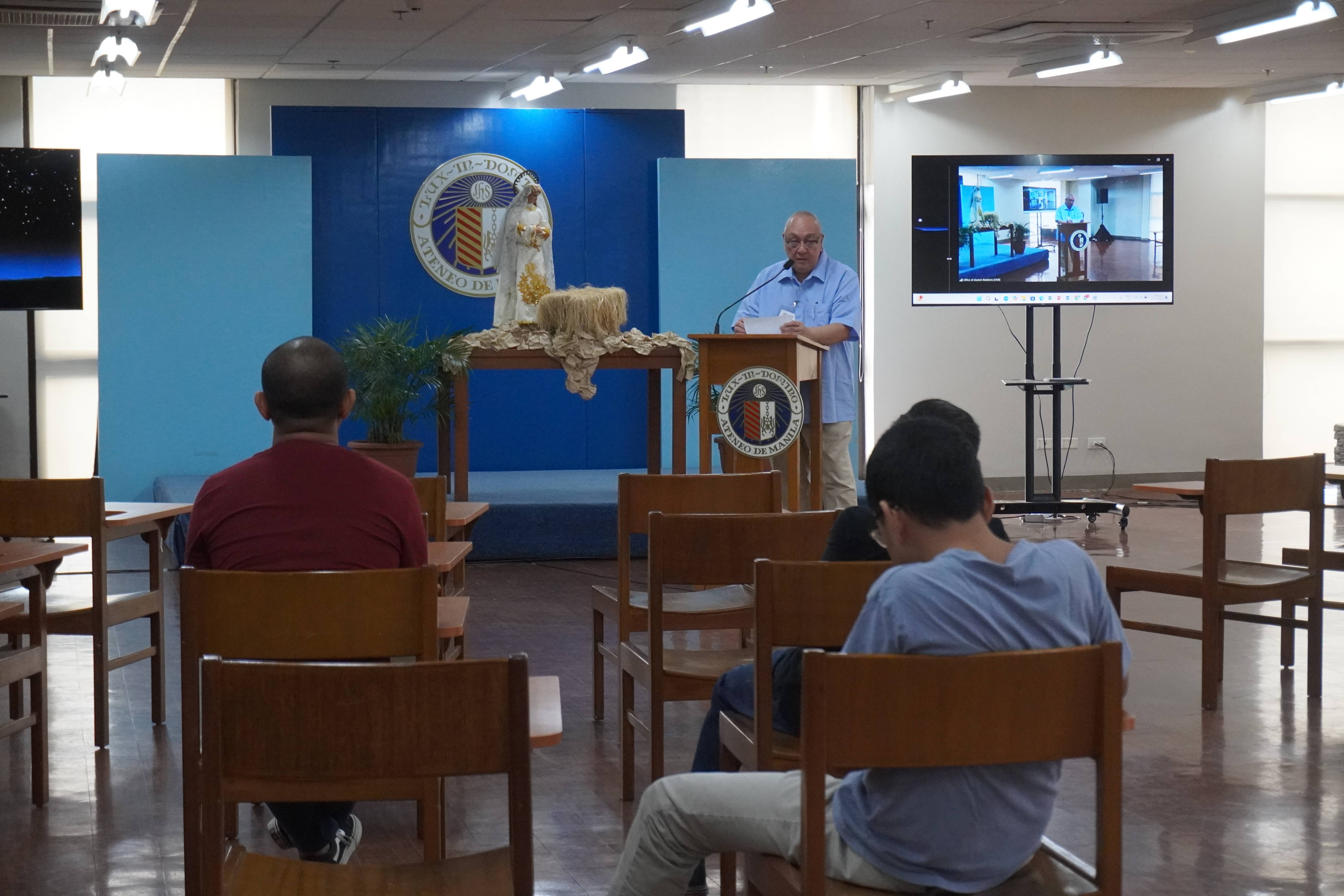 Office of University Development & Alumni Affairs (OUDAA) Director introduces the recollection master Fr. Edwin Castillo, S.J. at the start of the program.