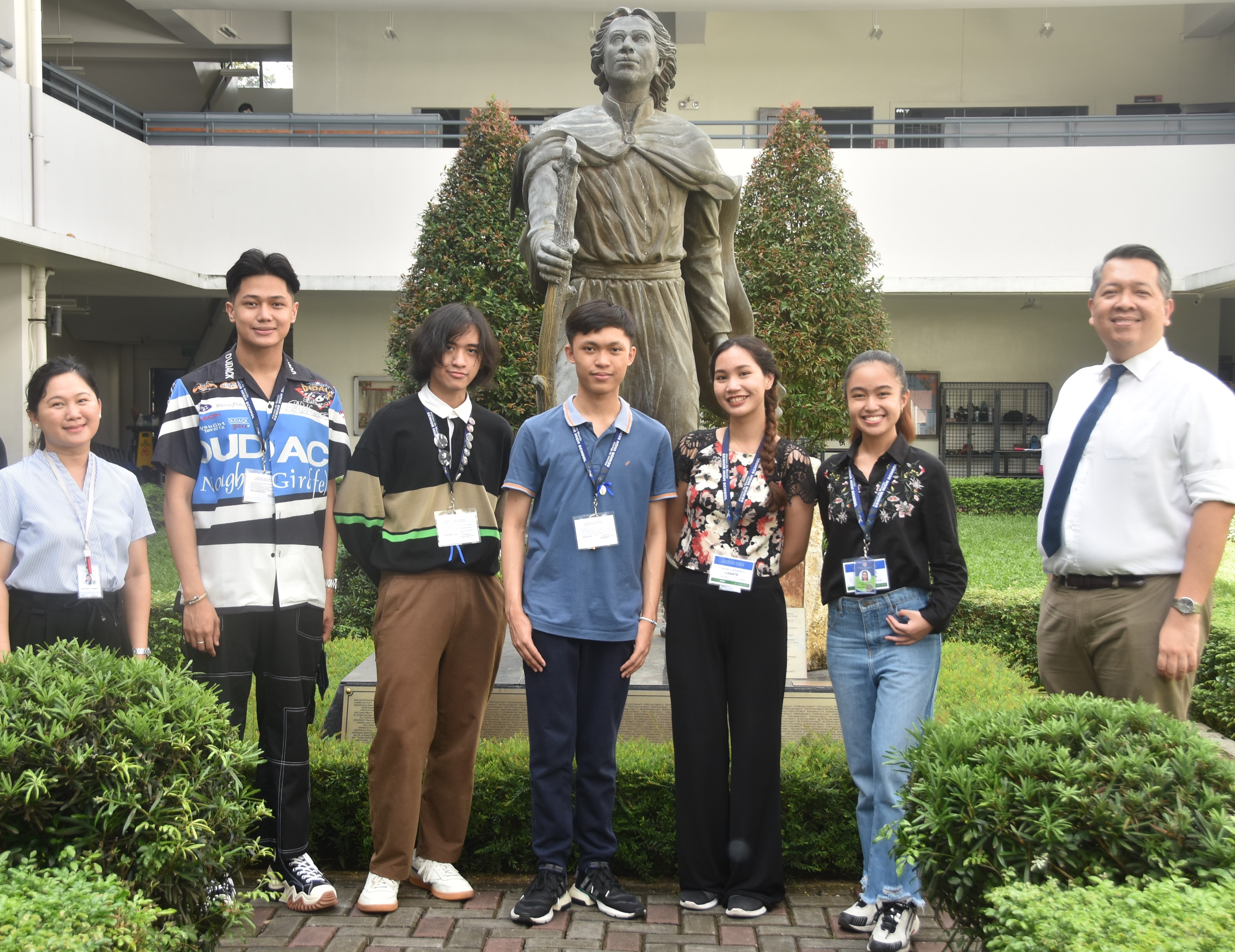(L-R) Melinda Cobar, Research Subject Area Coordinator; King Razon; Jose Clutario; Renzo Gutierrez; Gabbie Lasiste; Dani Barbacena; Noel Miranda, Principal  