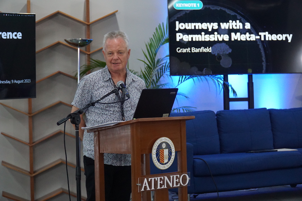 Grant Banfield delivers his talk called "Journeys with a Permissive Meta-Theory"