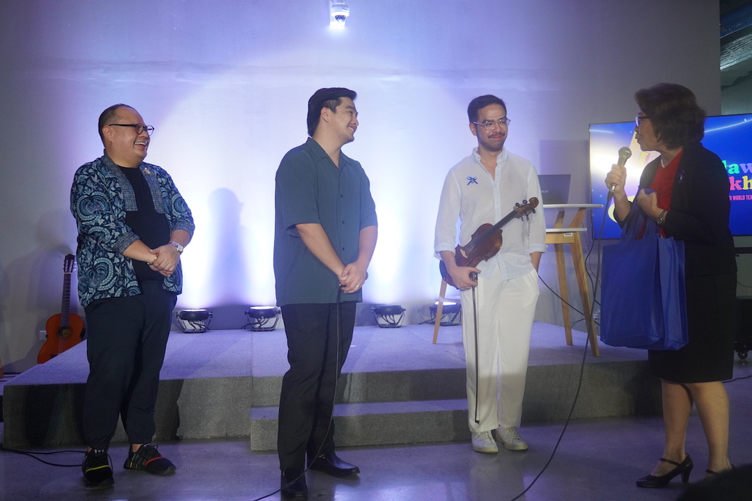 Dr Marlu Vilches thanks Mike, Jampao, and Henri for returning to Ateneo to celebrate World Teachers' Day with their teachers