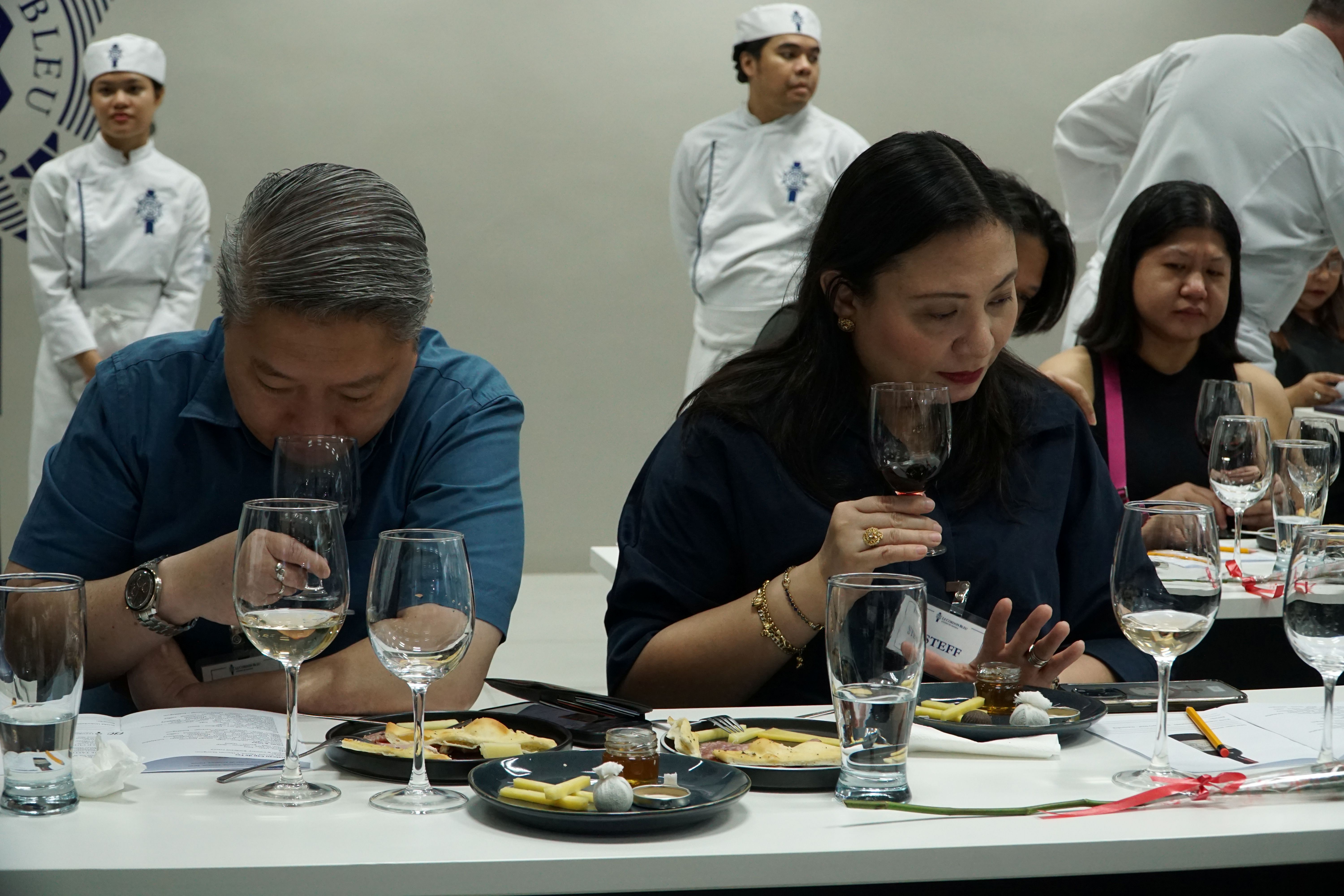 Attendees enjoy the suggested wine and food pairings.