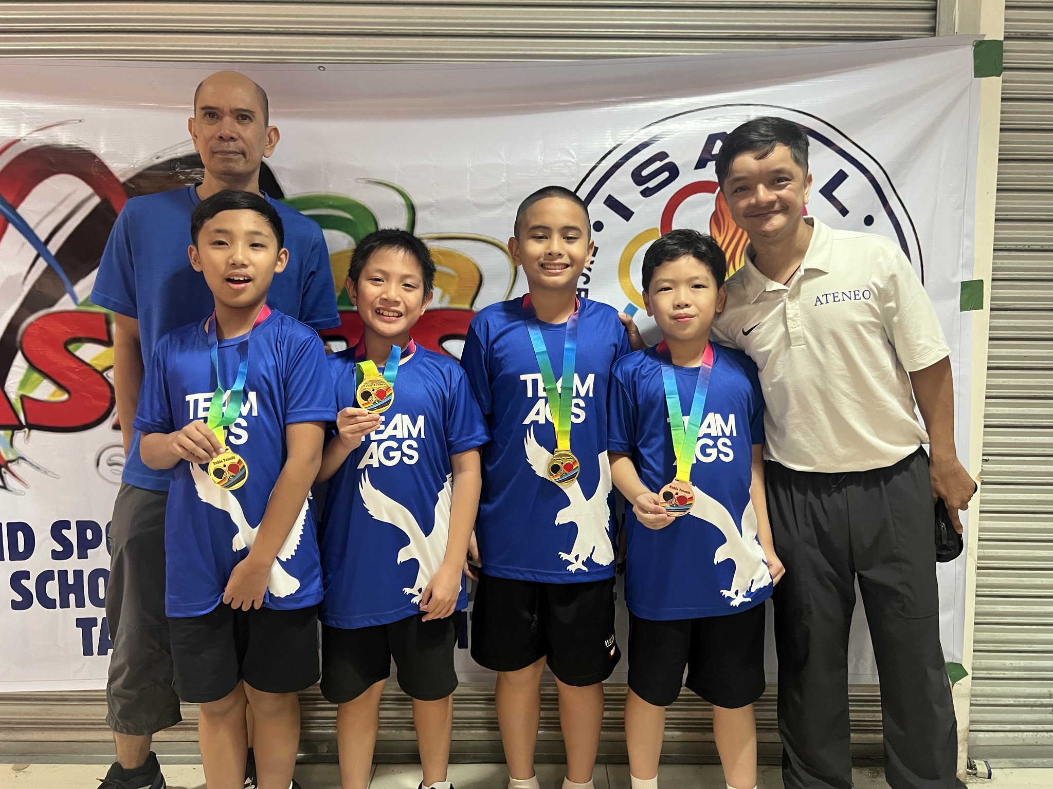 Front row from left: Philo Go, Karl Guanio, Titus Pachica, Rafa Tongson, Hali Crisostomo (Program Head for Ateneo Table Tennis); behind them: Coach Leo Raymundo