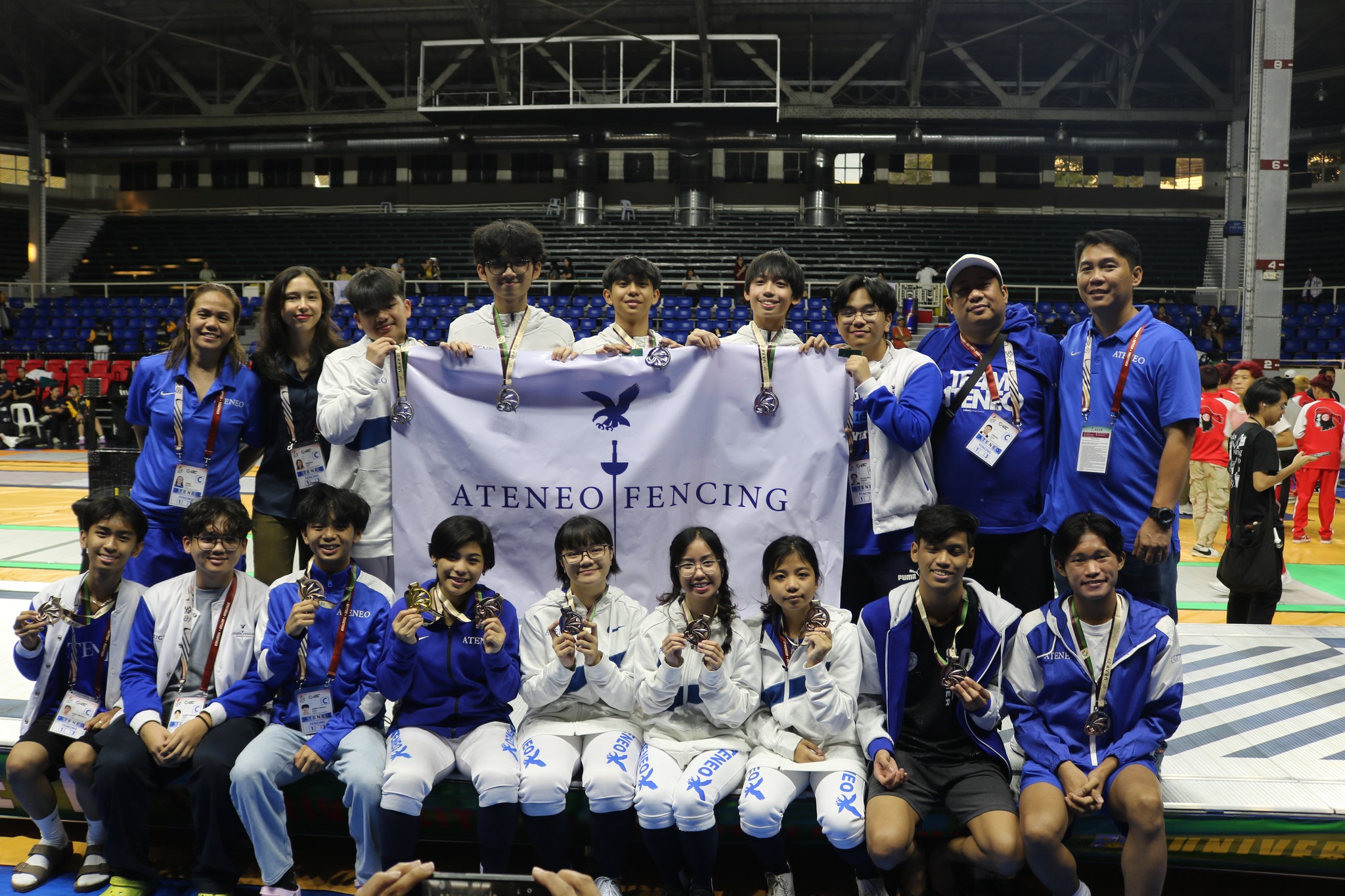 The boys and girls of Ateneo’s UAAP Season 87 fencing team with their coaches. Front row from left: Sean Ang, Albert Pascua, Derek Perez, Hannah Belarmino, Rana Rafael, Elouise Rodriguez, Louis Villegas, Zeb Largo, Noah Ibrahim; top row from left: Coach Veena Nuestro, Coach Bekah Reyno, Joaquin Ronsayro, Matthew General, Mairon Moulic, Adam Aceron, Julian Rosaros, Coach Edward Daliva, Coach Rupert Endriano; not in photo: Philippa Sunga, Julia Pablo, Samuel Gatmaytan 