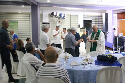 Office of University Development & Alumni Affairs (OUDAA) Director, Fr. Norberto “Kit” Bautista SJ giving Holy Communion to members of Batch HS '69, Col’73, ME’ 74 during their Bi-Annual Reunion.