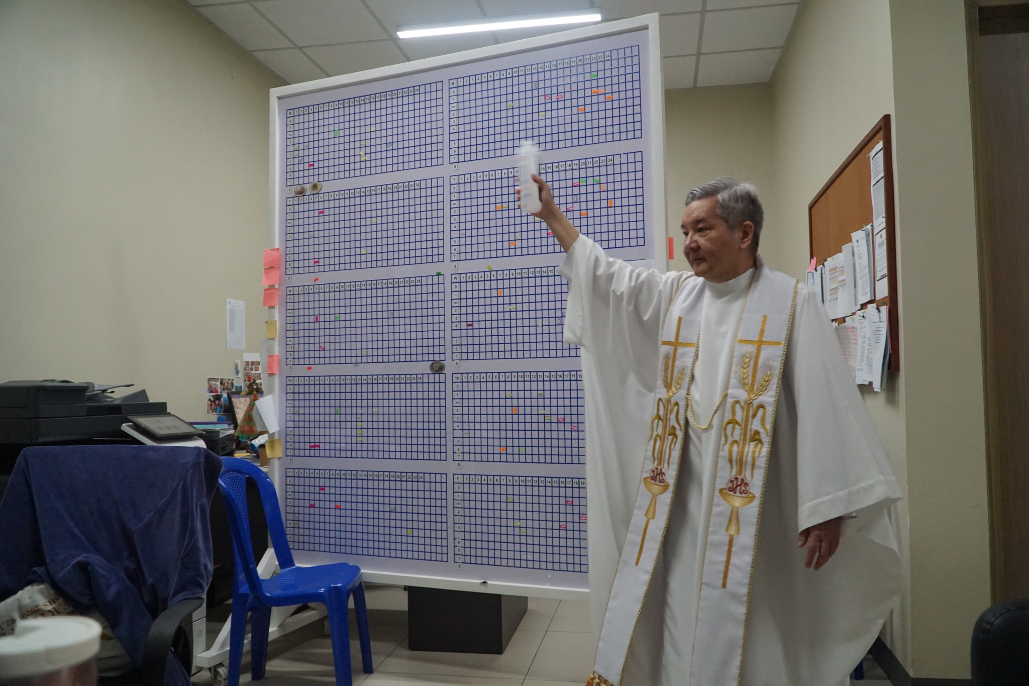 Fr Bobby Yap SJ blesses an office on the first floor of the FLC