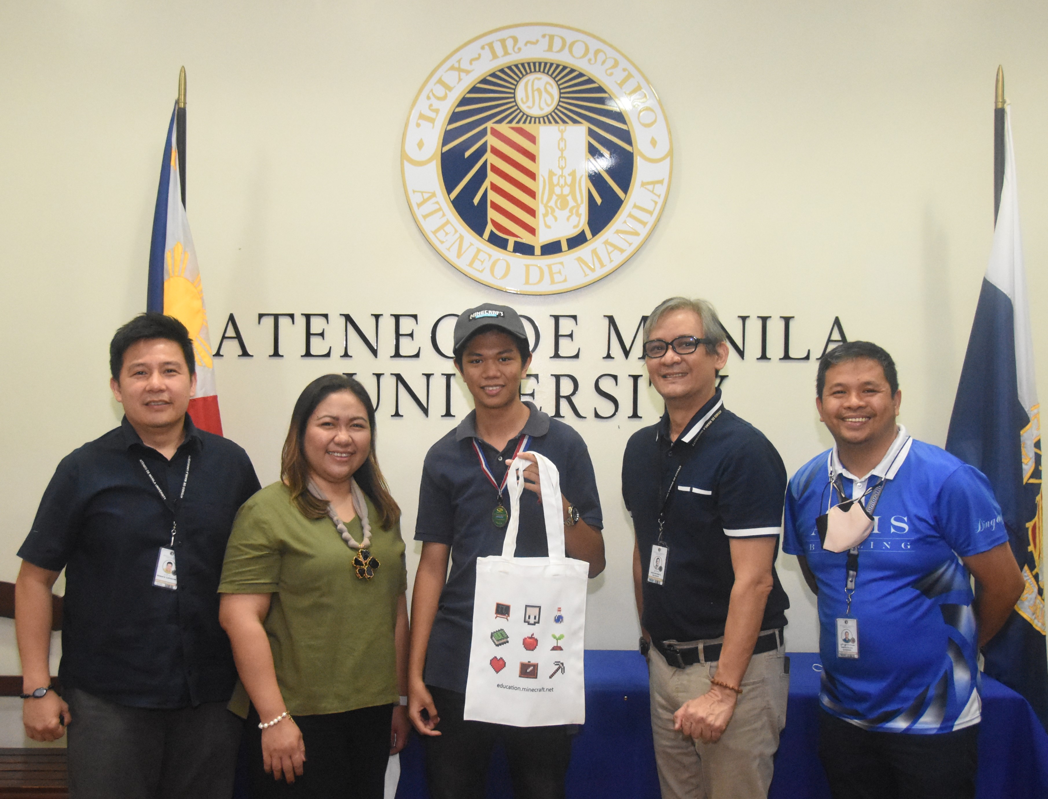 Top 5 finalist Gio Panlaqui (center) won a Minecraft baseball cap and eco bag from the organizers. From left: Ron Capinding, Gen Sanvictores, Gio, Jonny Salvador, Dingdong Guerrero