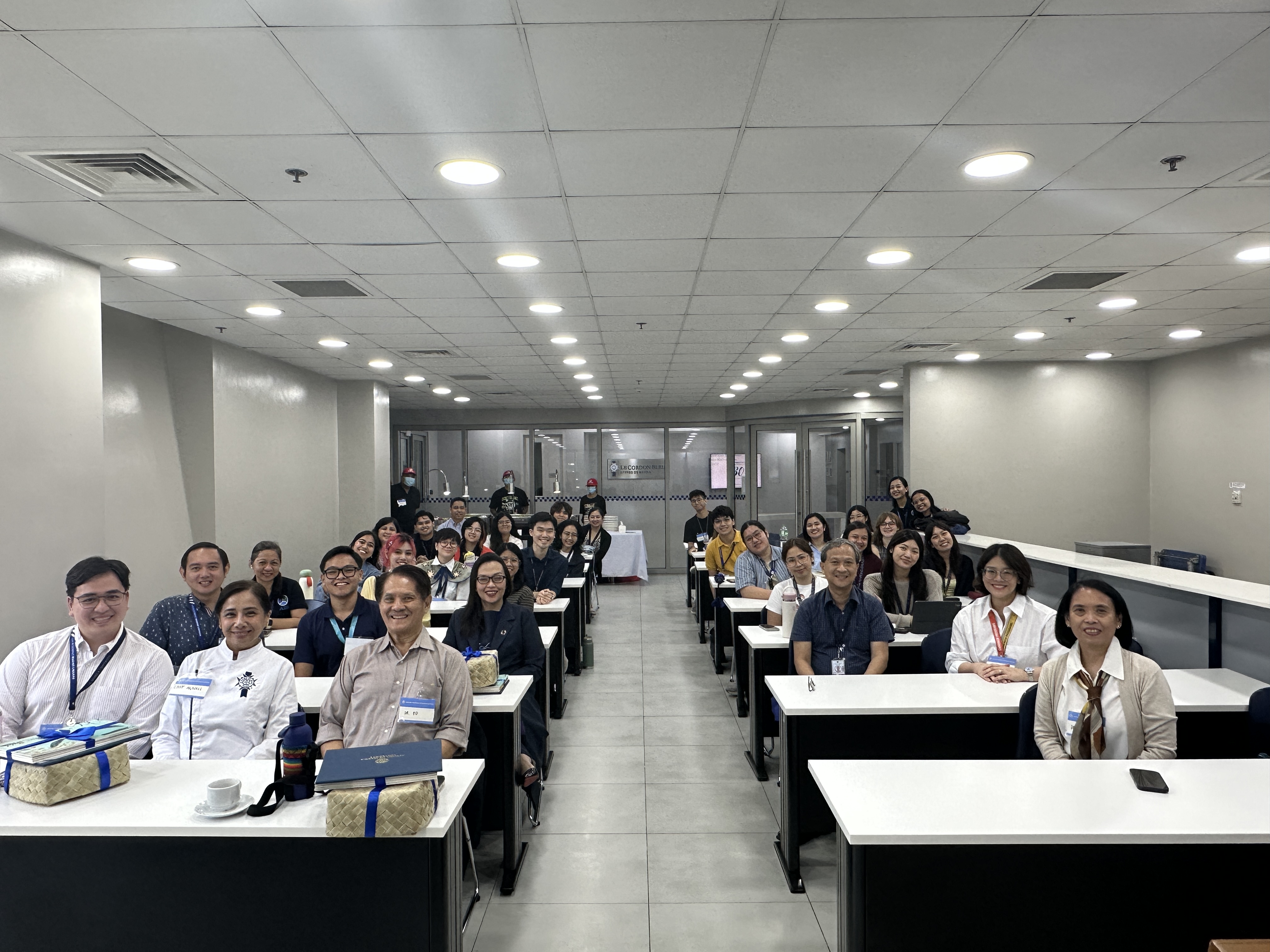Panelists and participants join in a group photo at Salon Dumas, Le Cordon de Bleu Ateneo 