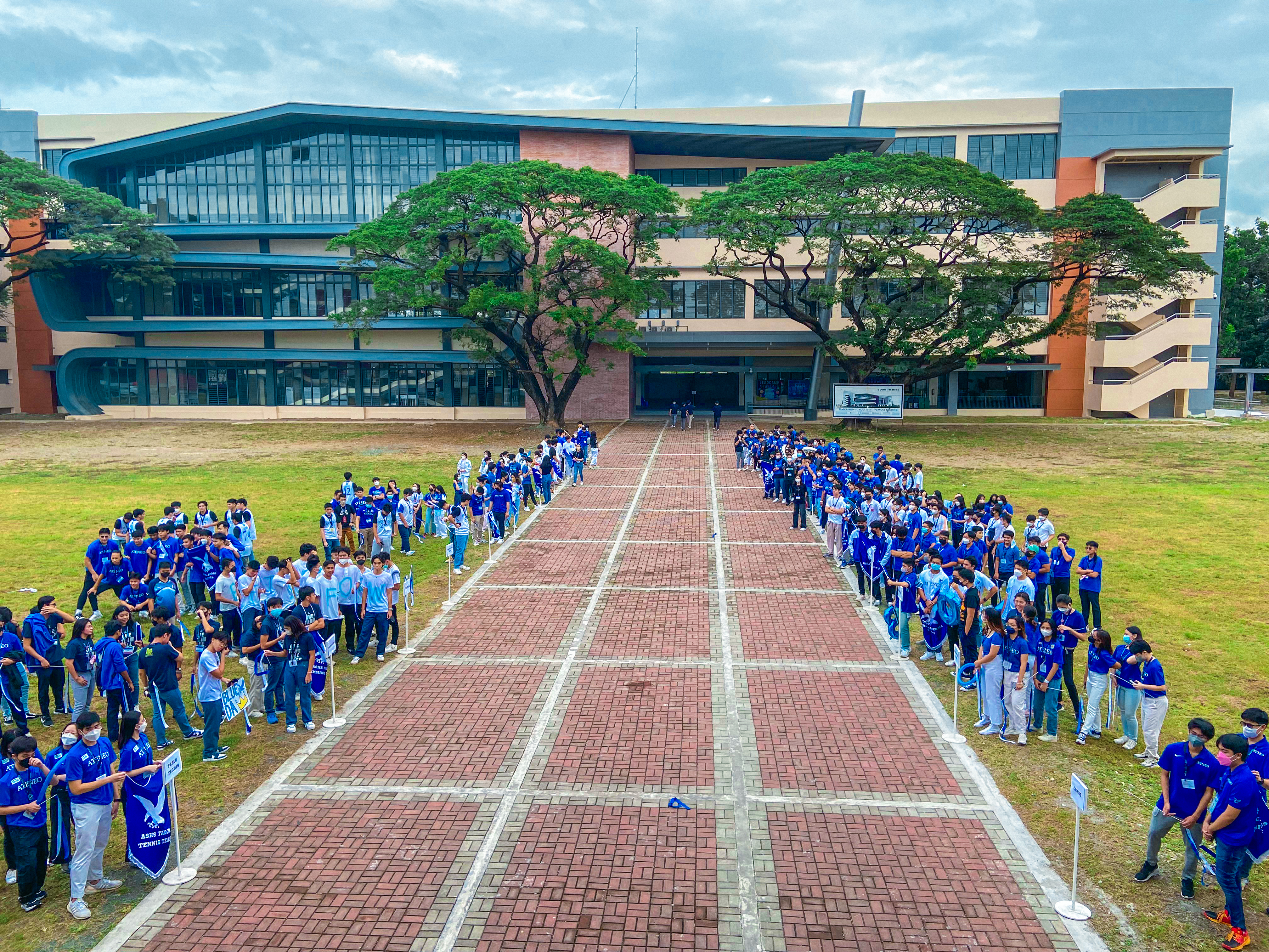 Athletes lined up along the FLC walkway