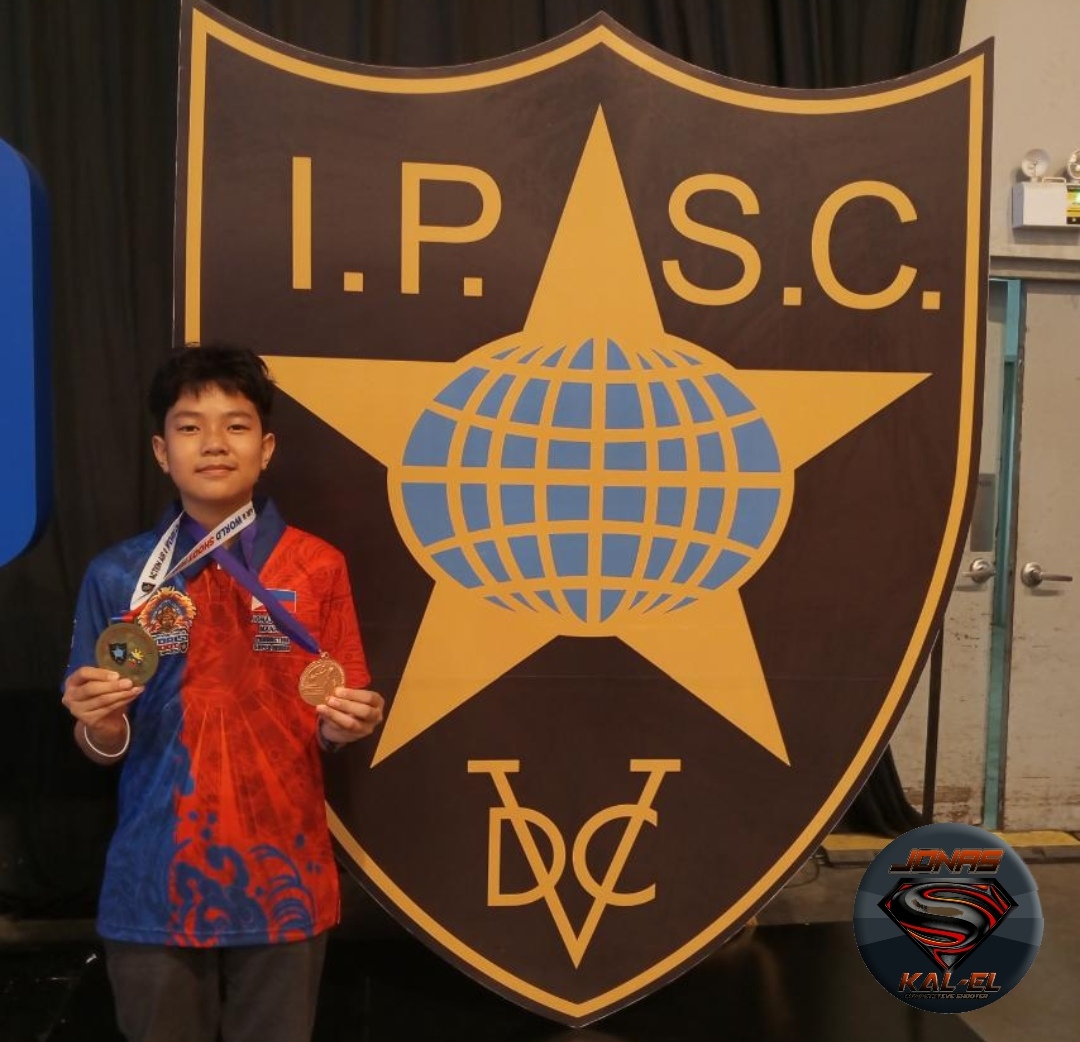 Ka-el Manalo wearing his 3 medals