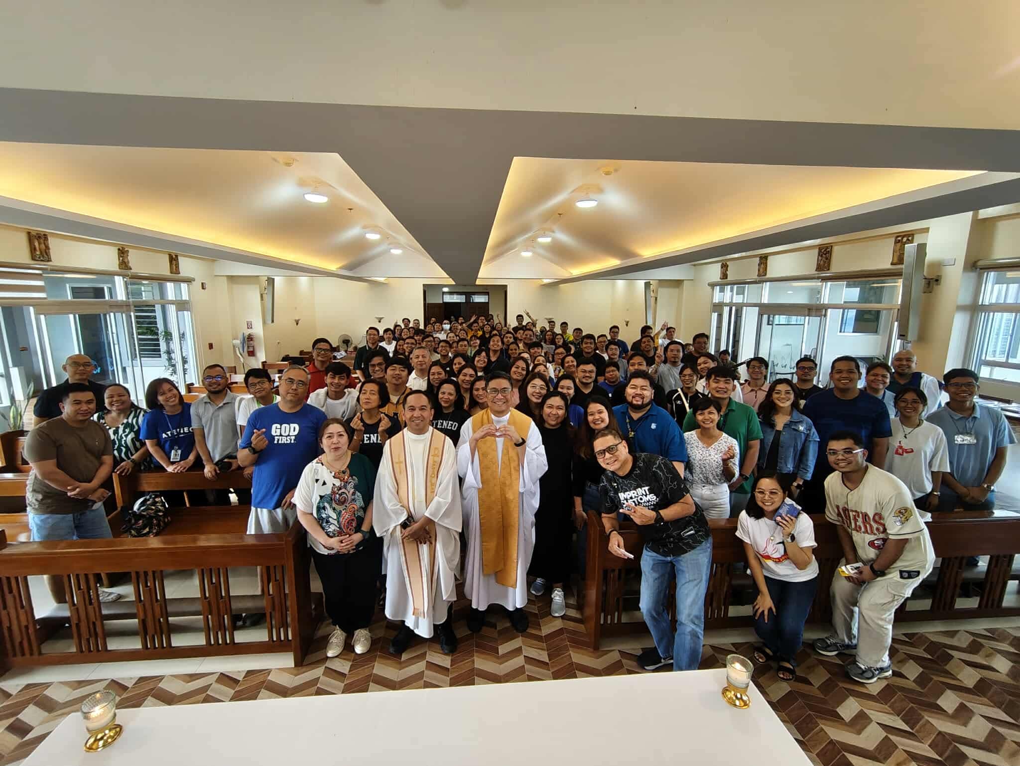 Fr Jordan Orbe SJ (center, doing a finger heart), director of the Emmaus Center for Psycho-Spiritual Formation and Accompaniment, poses with the AJHS faculty and staff after the three-day retreat entitled Sacred Reset: A Mindful Return to What Matters