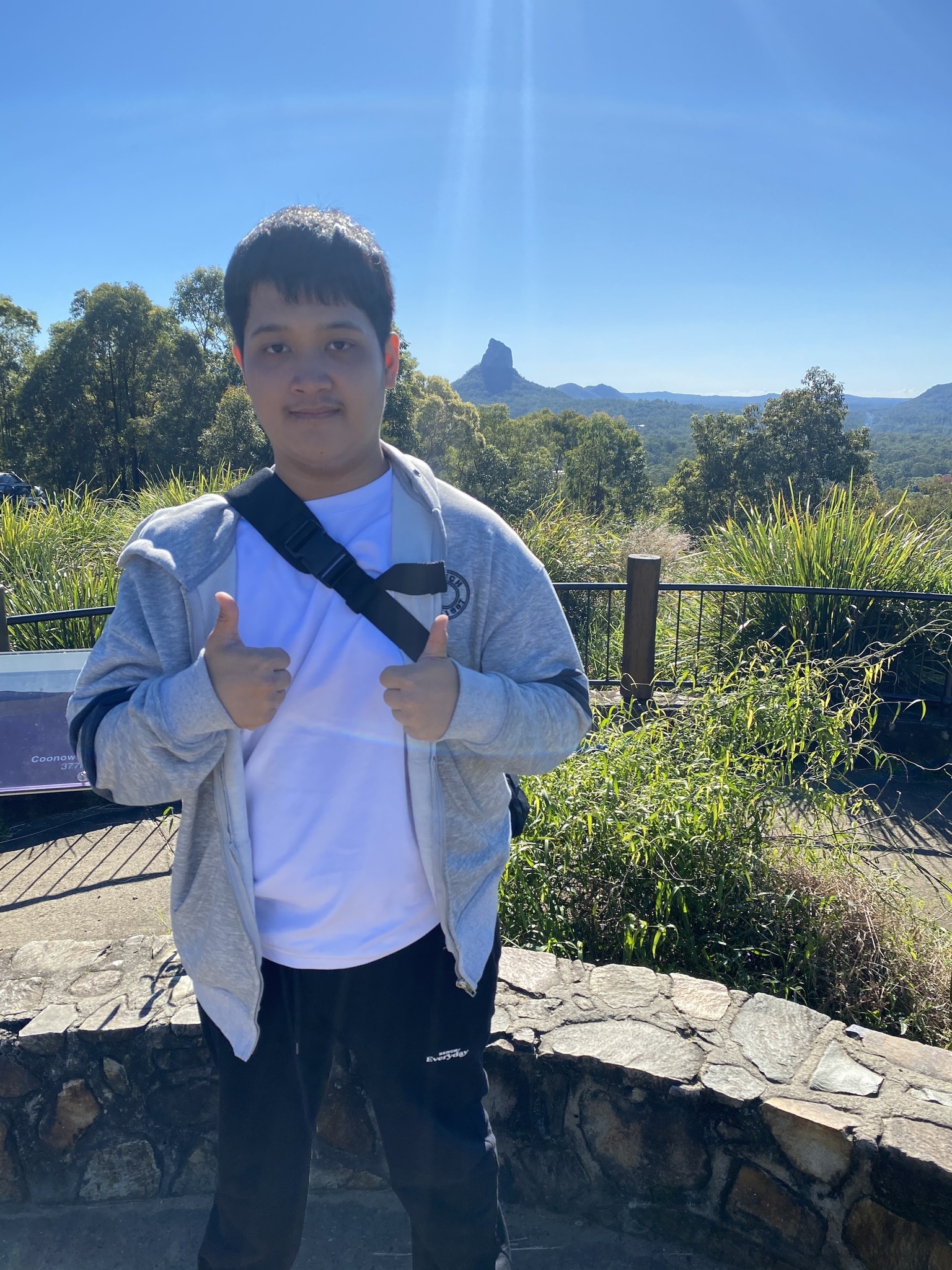 Mikee posing with the Glasshouse Mountains