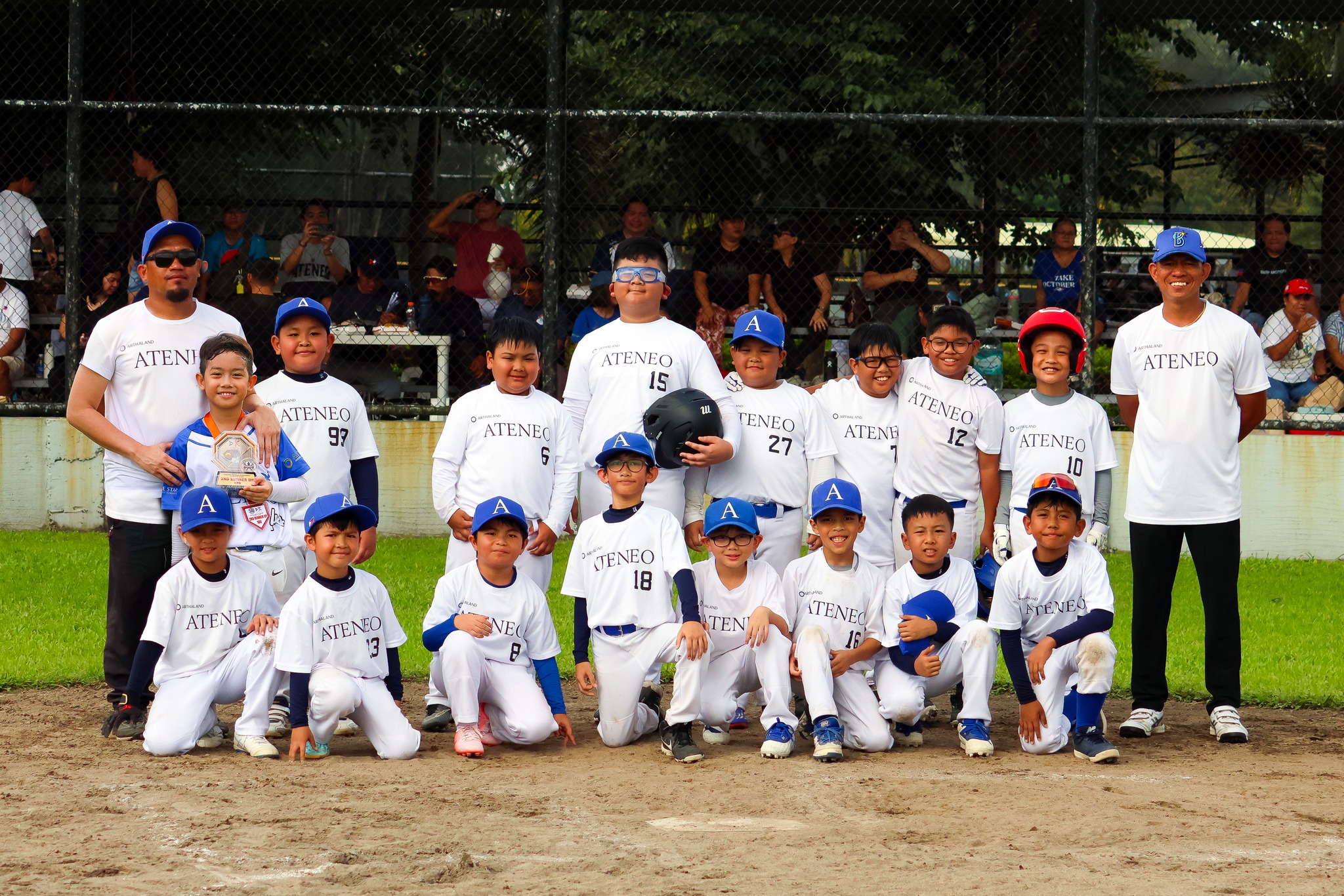 Front row from left: Hugo De Vera, Elias Tiston, Theo Buenviaje, Davien Caro, Franco Crisologo, Bucky Aligada, Santi Narcelles, Matthew Panis; back row standing from left: Poul Delos Santos (Assistant Coach), Lukas Angeles, Braven Busto, Jac Amaya, Jairus Sillorequez, Enzo Lavides, Matti Escalante, Jacob Simeon, Liam Dela Cruz, Francis Gahuman (Head Coach)