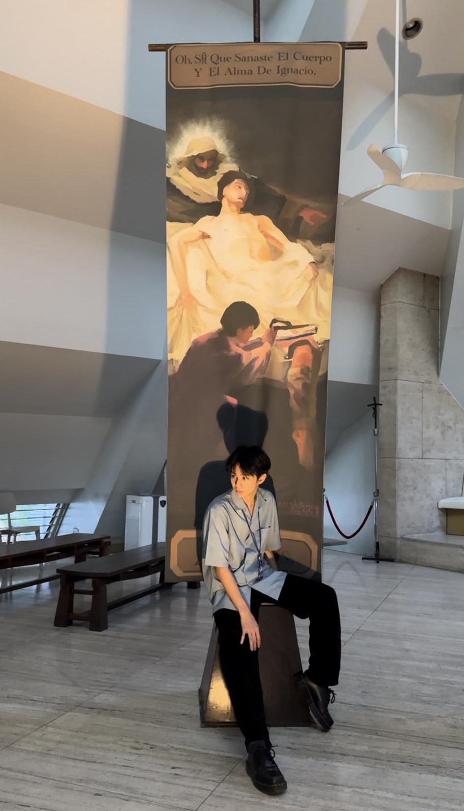 The artist poses with his creation in the Church of the Gesù&nbsp;