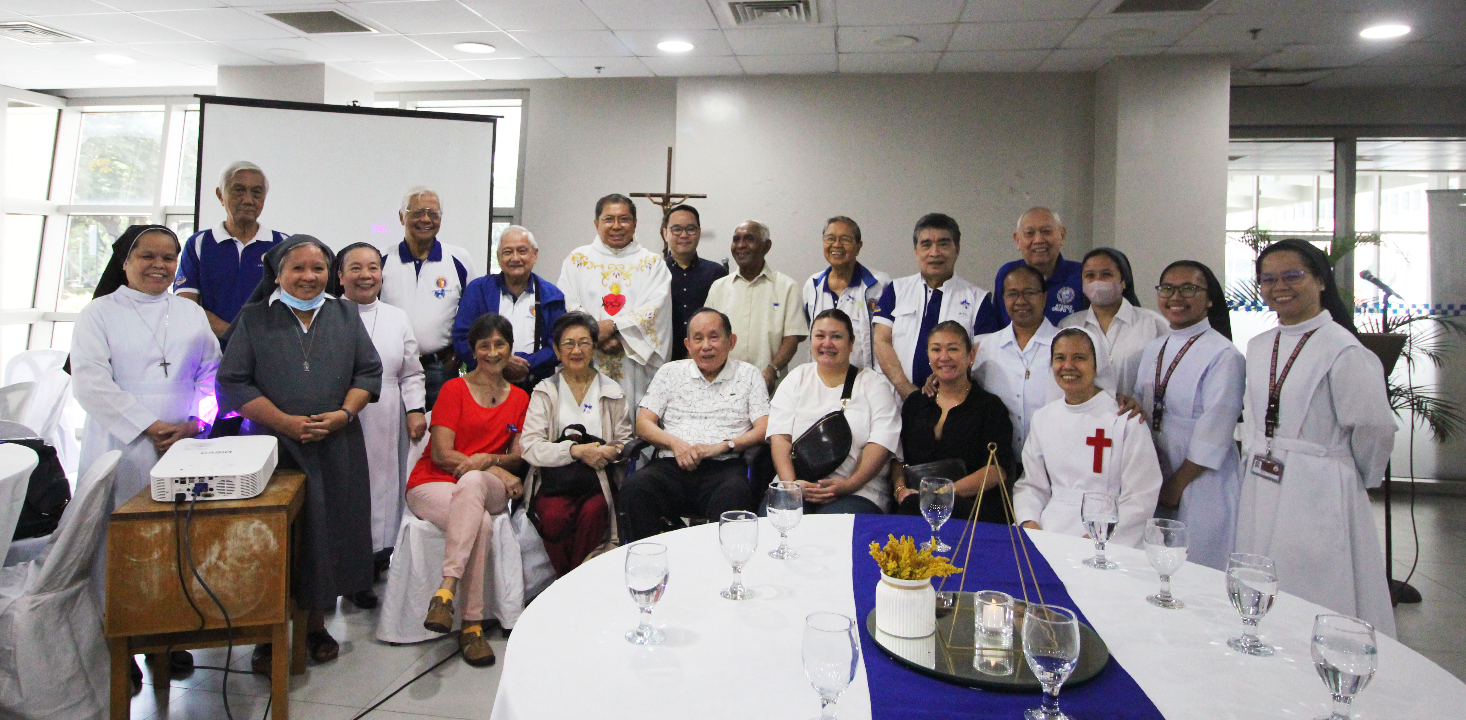 Sisters representing the Carmelite Sisters of Charity (Verduna); Missionary Catechists of the Sacred Heart; Religious of the Virhin Mary; and the Camillian Sisters together with members of the Ateneo HS Grupo’58. Standing from left to right: Randy Gavino, Rene Anel, Butch Bonoan, Fr. Manny Flores SJ, Eric Ledesma, Fr. Balch Balchand SJ, Timmy Nivera, Ray Lesaca and Johnny Romualdez. Seated from left to right Cora Anel, Estela Nivera, Art Ledesma, Verne Romualdez, and Ines Romualdez.