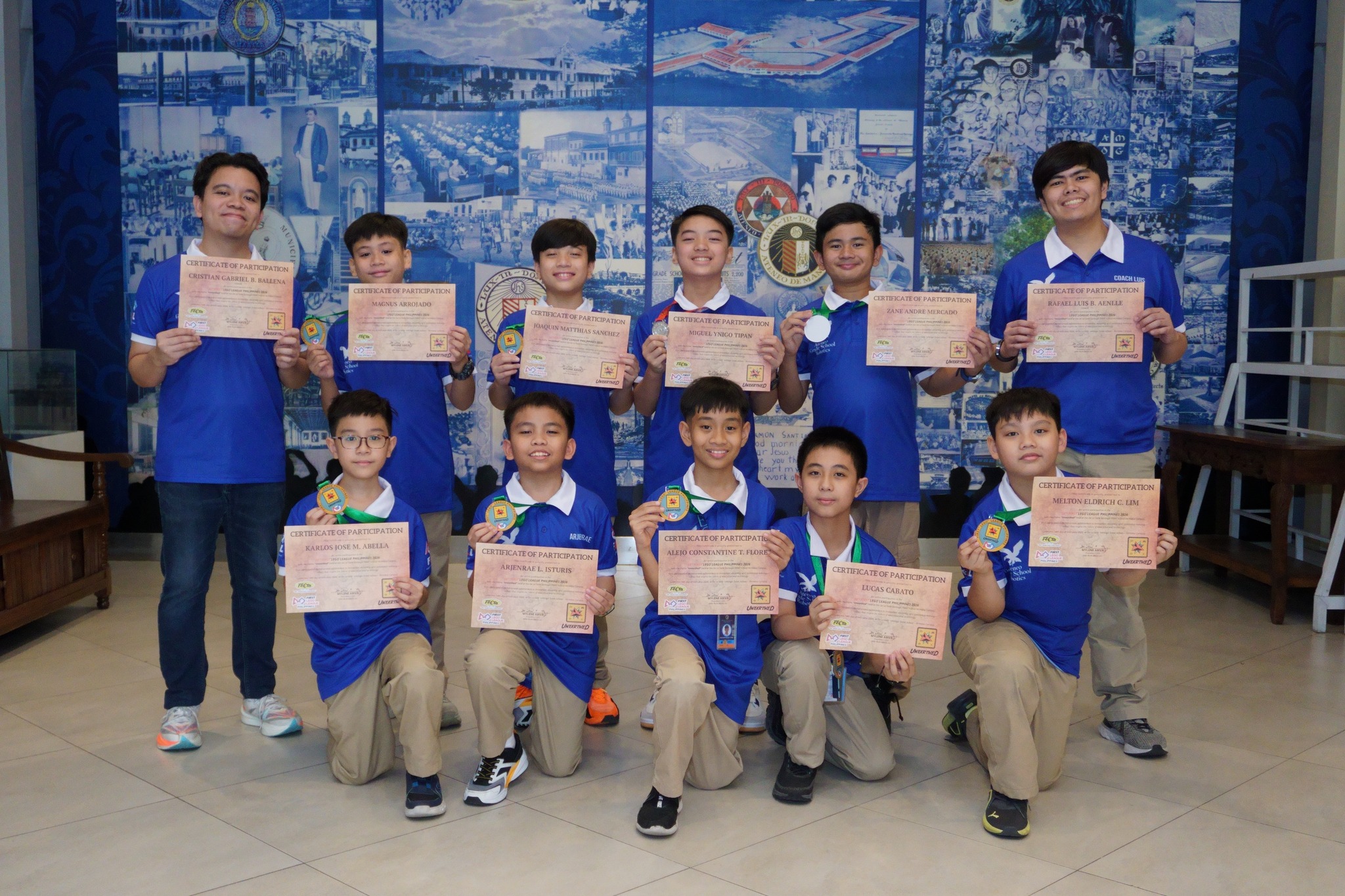 Front row from left: Karlos Jose M. Abella, Arjenrae L. Isturis, Alejo Constantine T. Flores, Lucas Cabato, Melton Eldrich C. Lim; back row from left: Cristian Gabriel B. Ballena (Coach), Magnus Arrojado, Matthias Joaquin Sanchez, Miguel Ynigo Tipan, Zane Mercado, Rafael Luis B. Aenlle (Coach)