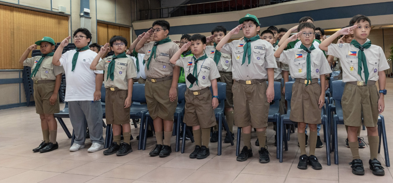 A moment of pride and respect as Boy Scouts celebrate their achievements and dedication to service during their Court of Honor ceremony