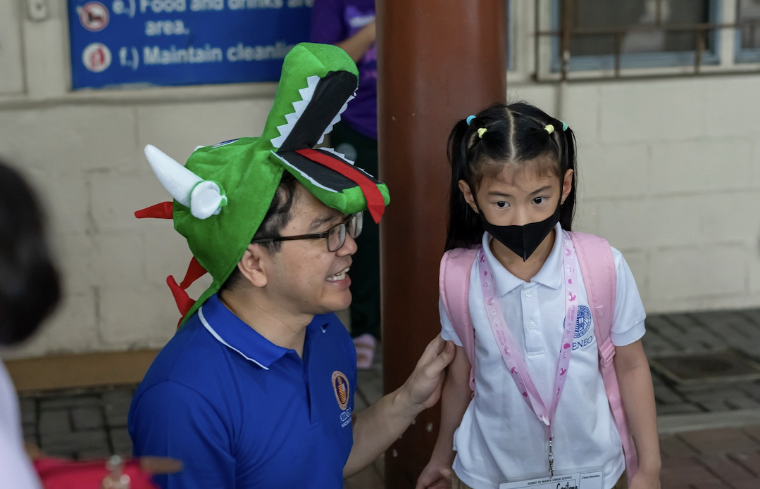Headmaster Jervy Robles and a new Atenean 