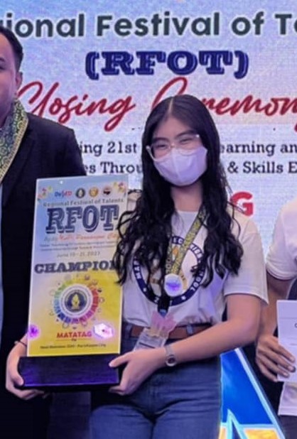 Thea Natividad with her Pintahusay trophy 