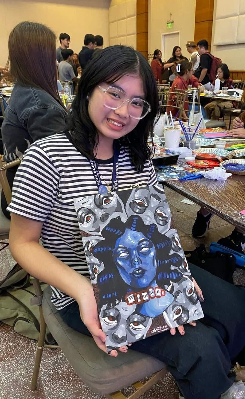 Thea poses with her obra 