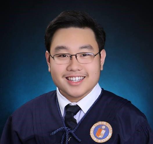 A graduation photo of the author, in an Ateneo toga