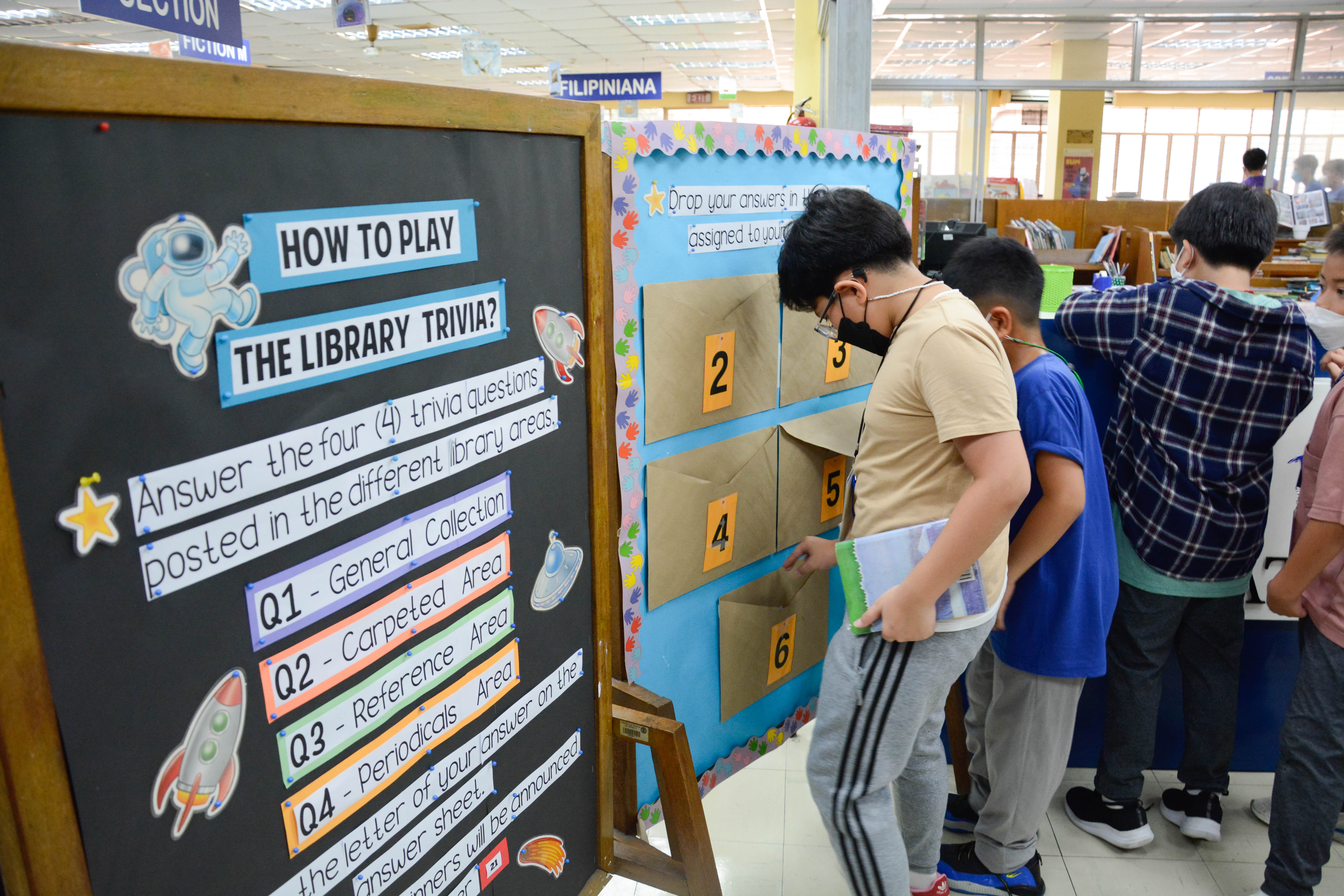 AGS students answering the Daily Library Trivia questions in the KEMC