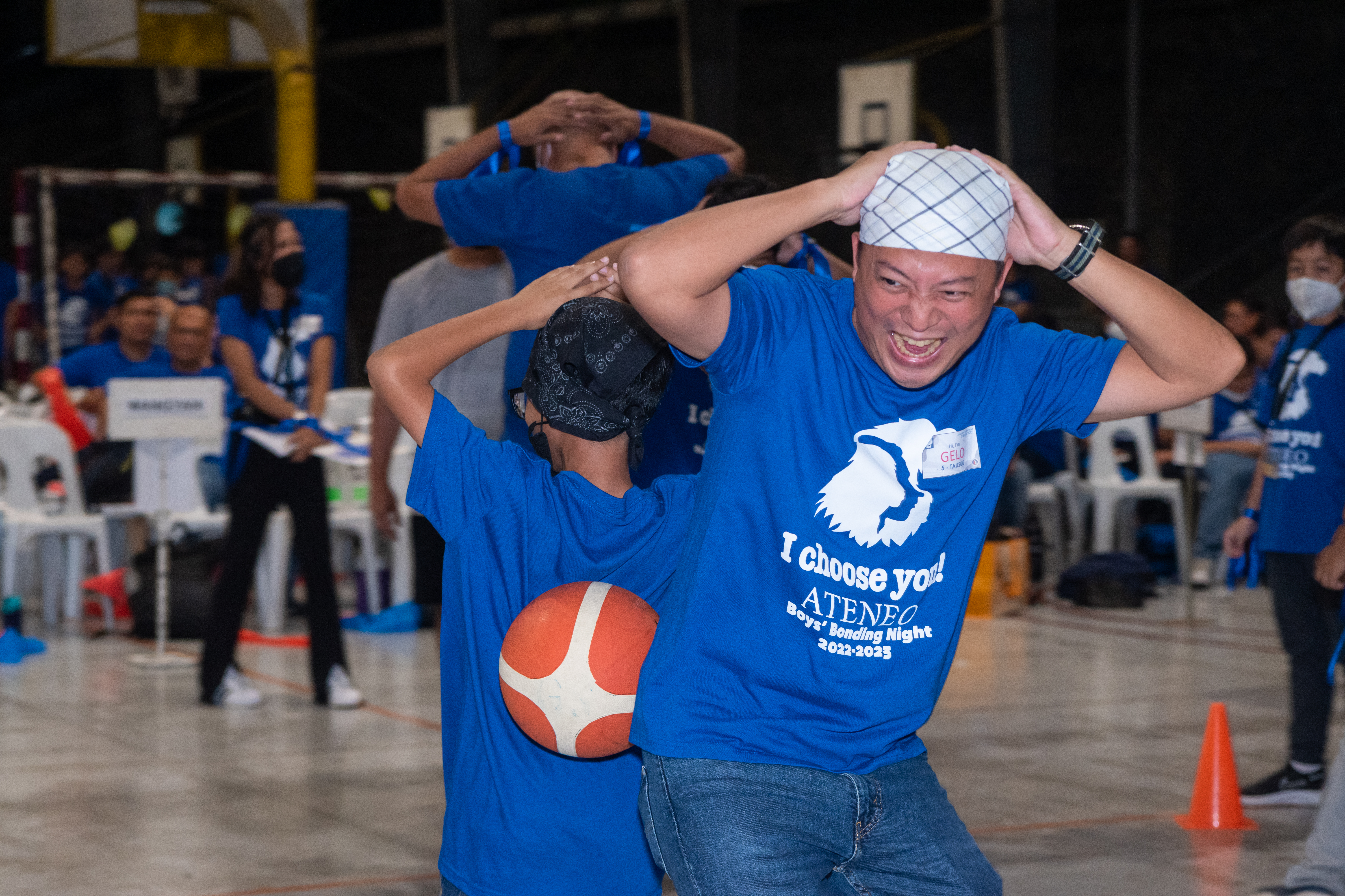 A father looking enthusiastic while playing the challenging relay game with his son… priceless!