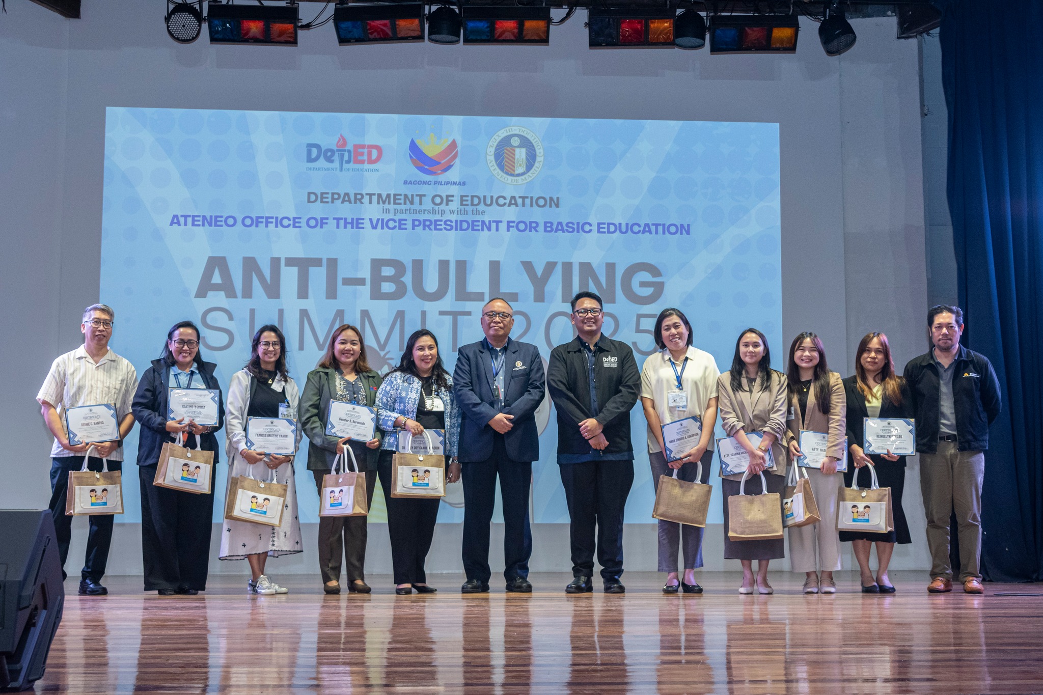 Following the summit, speakers were presented with certificates and tokens of appreciation: (L-R) Mr Bernie Santos (AJHS), Mrs Virgie Esteves (AGS), Mrs Kristine Villegas Canon (Creating Learning Paths School), Ms Genefer Bermundo (Batasan Hills National High School), Dr Joy Canon Abaquin (Multiple Intelligence International School), Fr Joaquin Jose Maria Sumpaico, SJ (VP for Basic Education, Ateneo de Manila University), Dr Dexter Galban (Assistant Secretary for Strategic Management, DepEd), Mrs Jennifer Concepcion (ASHS), Atty Czarina Michaella Pleyto (DepEd), Atty Nadine Francesca Ong (DepEd), Ms Reingelyn Donato (Concepcion Elementary School), and Mr Ysrael Diloy (Stairway Foundation)