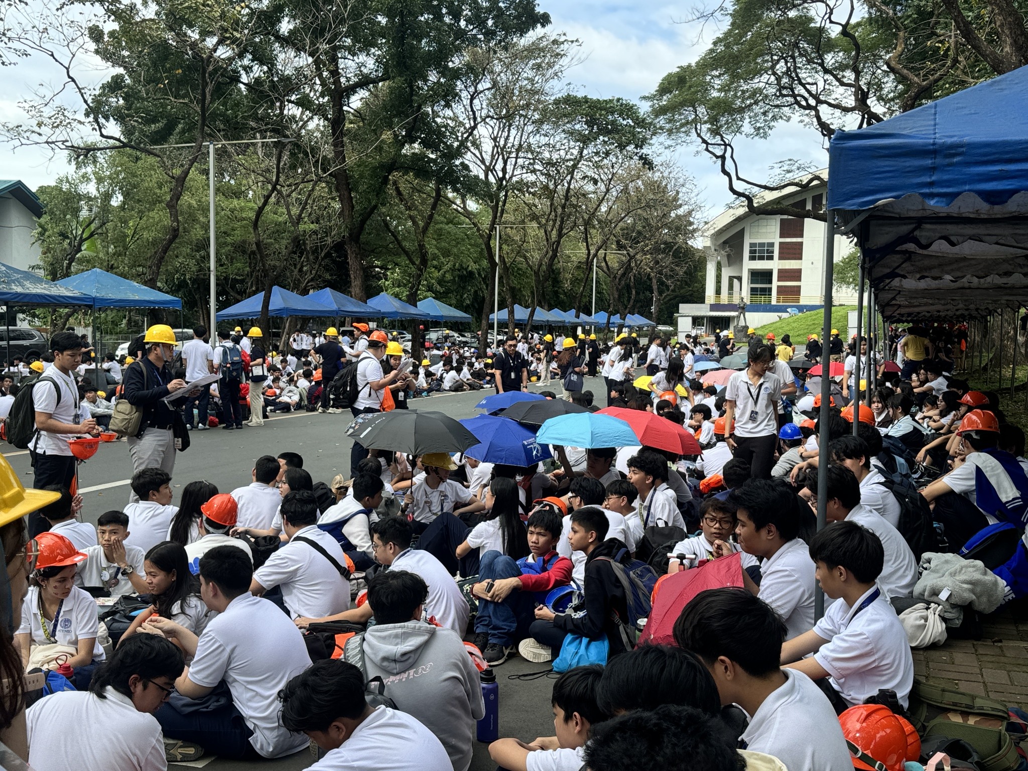 Grade 8 to 10 students occupying the servers located on the carpark