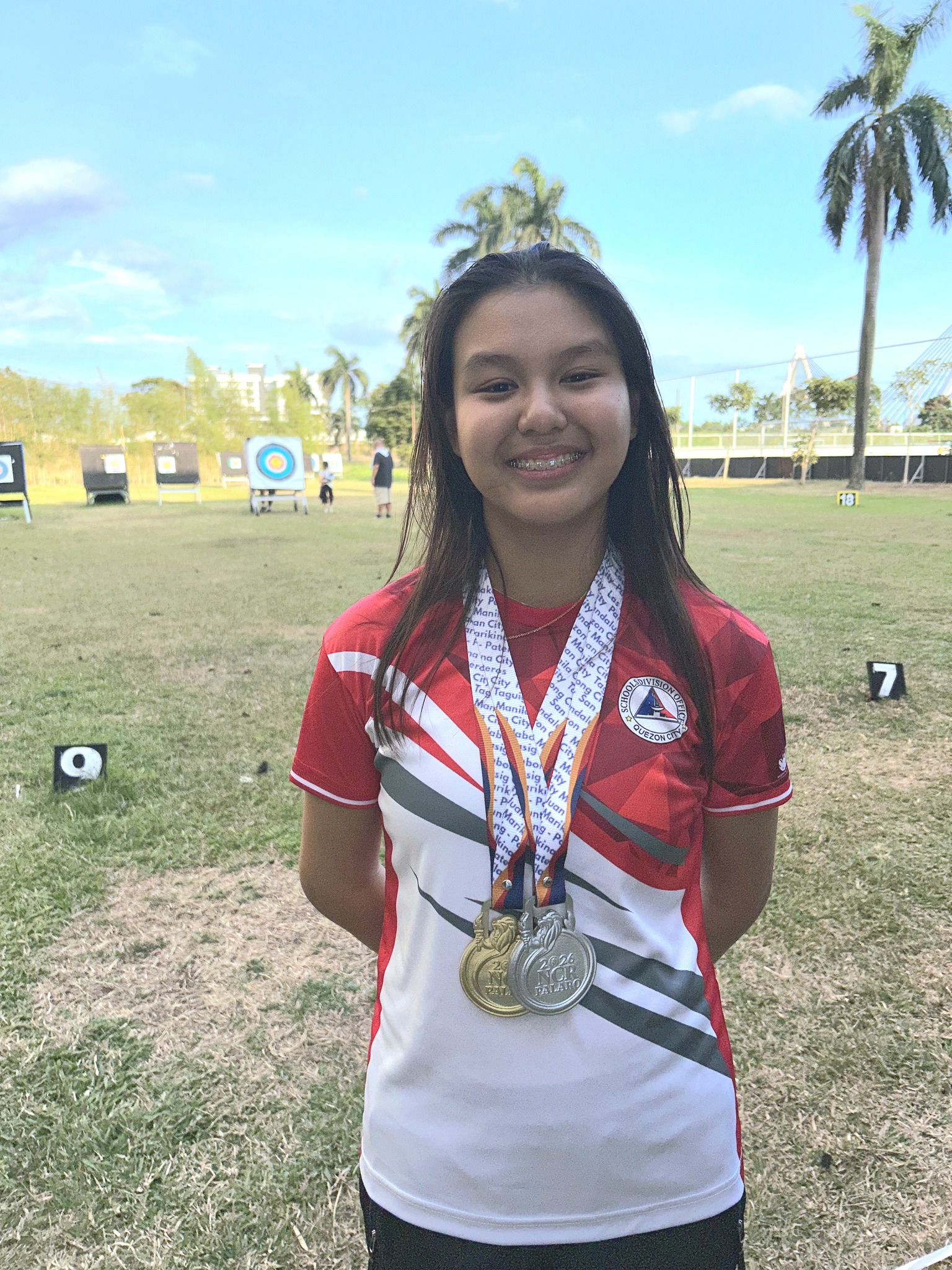 Sophie Abaya with her gold and silver medals 