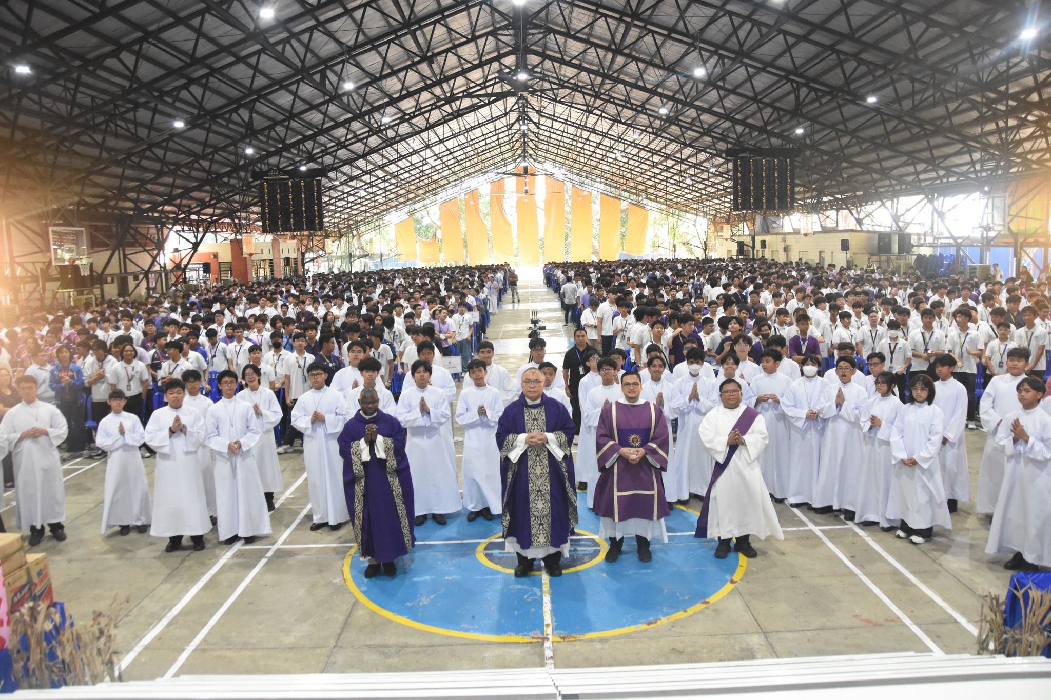 Front row center: Fr. Firmino W Mulunda Cachipato, SJ (from Arrupe International Residence),  Fr. Joaquin Jose Mari C. Sumpaico III, SJ (Vice-President for Basic Education), Rev. Deacon Alejo S. San Buenaventura, SJ and Rev. Deacon Rico Jaen Adapon, SJ pose for posterity with the JHS community in the background at the conclusion of Ash Wednesday Mass.
