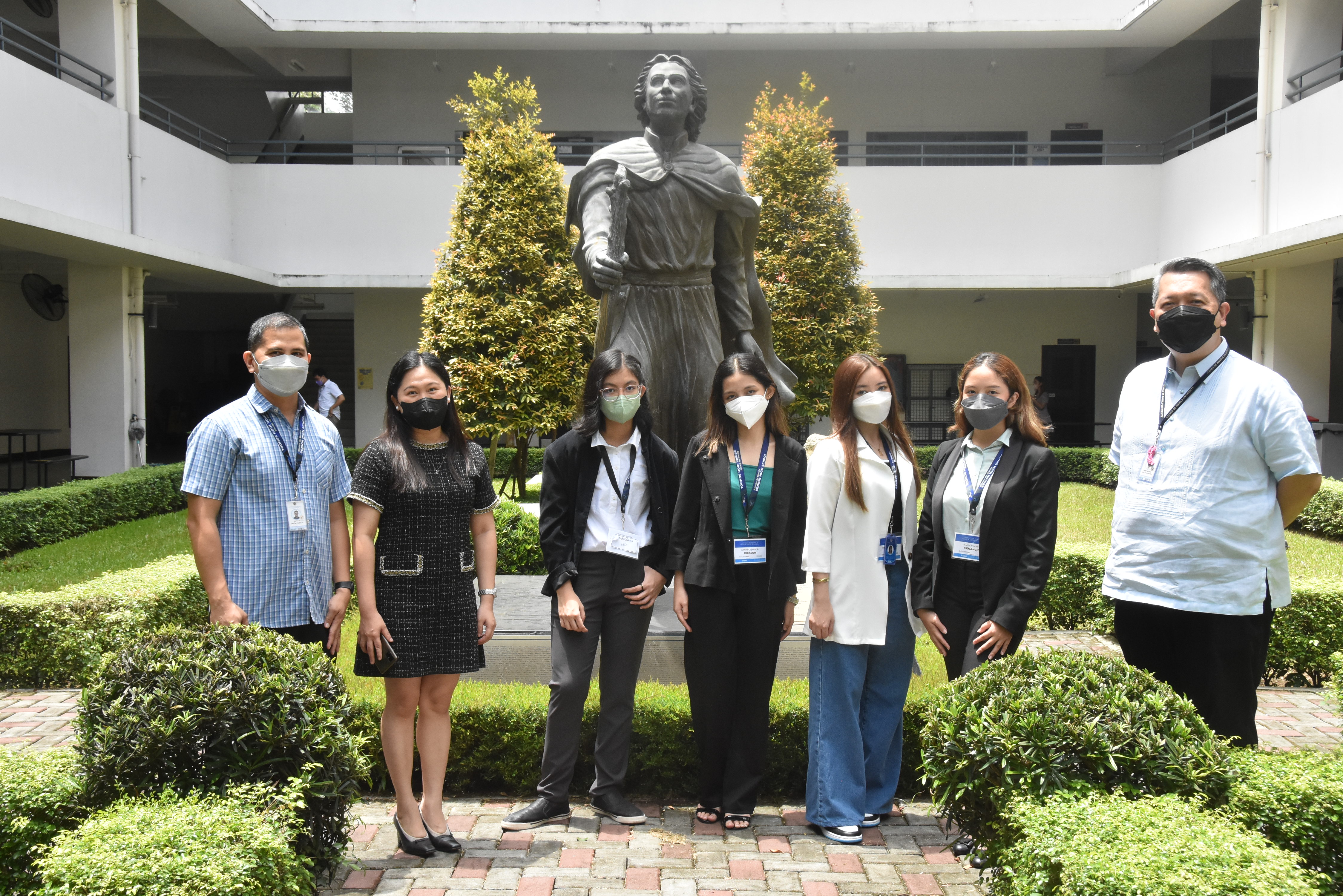 (L-R) ASHS Assistant Principal for Academics Mr. Javy Fabello, Research Adviser Mrs. Mel Cobar, Jam Eclarin, Almira Dickson, Sophia To, Luvic Venancio, and ASHS Principal Mr. Noel Miranda