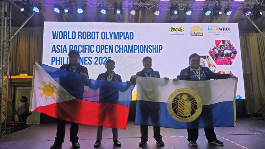Proud Ateneans, prouder Filipinos! From left: Junby Layaoen, Marcus Crisostomo, Liam Daga, and Coach Jason Arias onstage at the WRO Asia-Pacific Open Championship 2025.