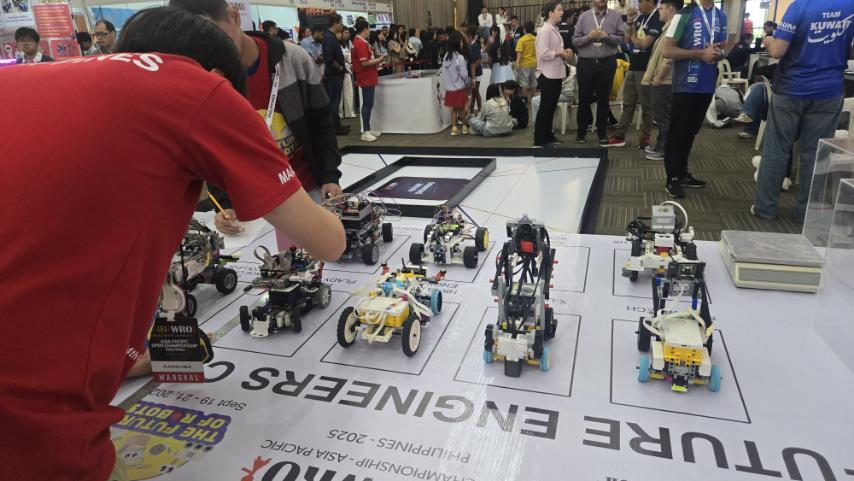 The self-driving cars competing in the WRO Asia-Pacific Future Engineers. The car made by Ateneo BluBLOC is on the top row, second from left.