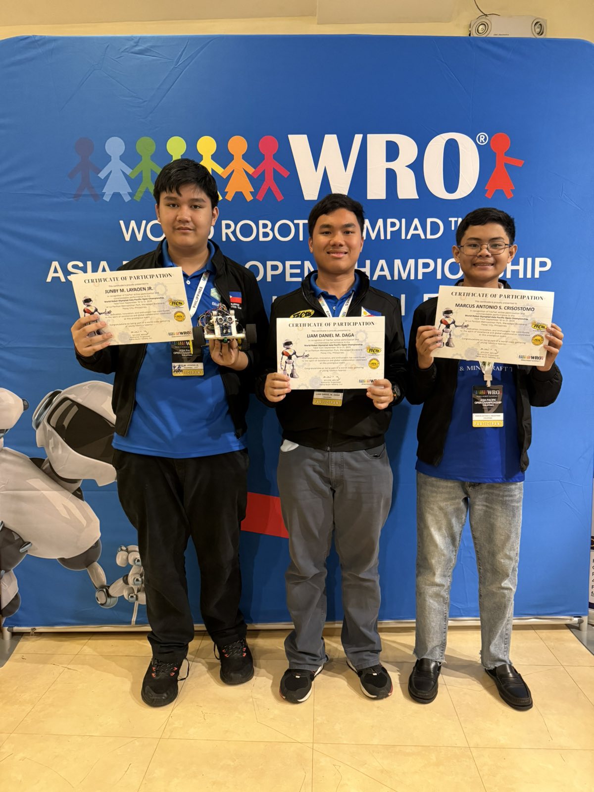Ateneo BluBLOC’s Future Engineers Team at the WRO Asia-Pacific Open Championship (from left): Junby Layaoen, Liam Daga, Marcus Crisostomo