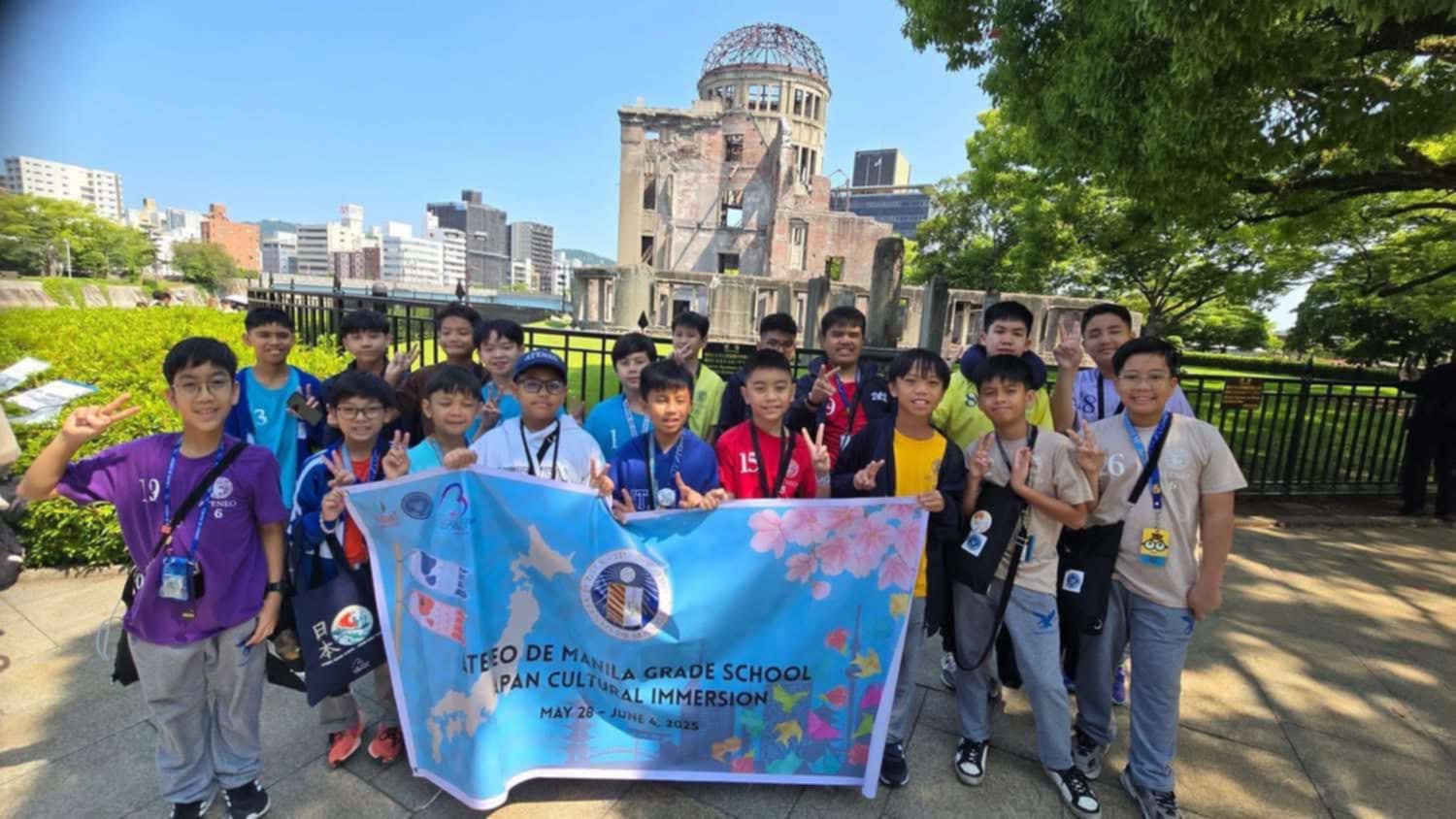 At the Peace Memorial Park with the Atomic Bomb Dome in the background. The park is a UNESCO World Heritage Site.