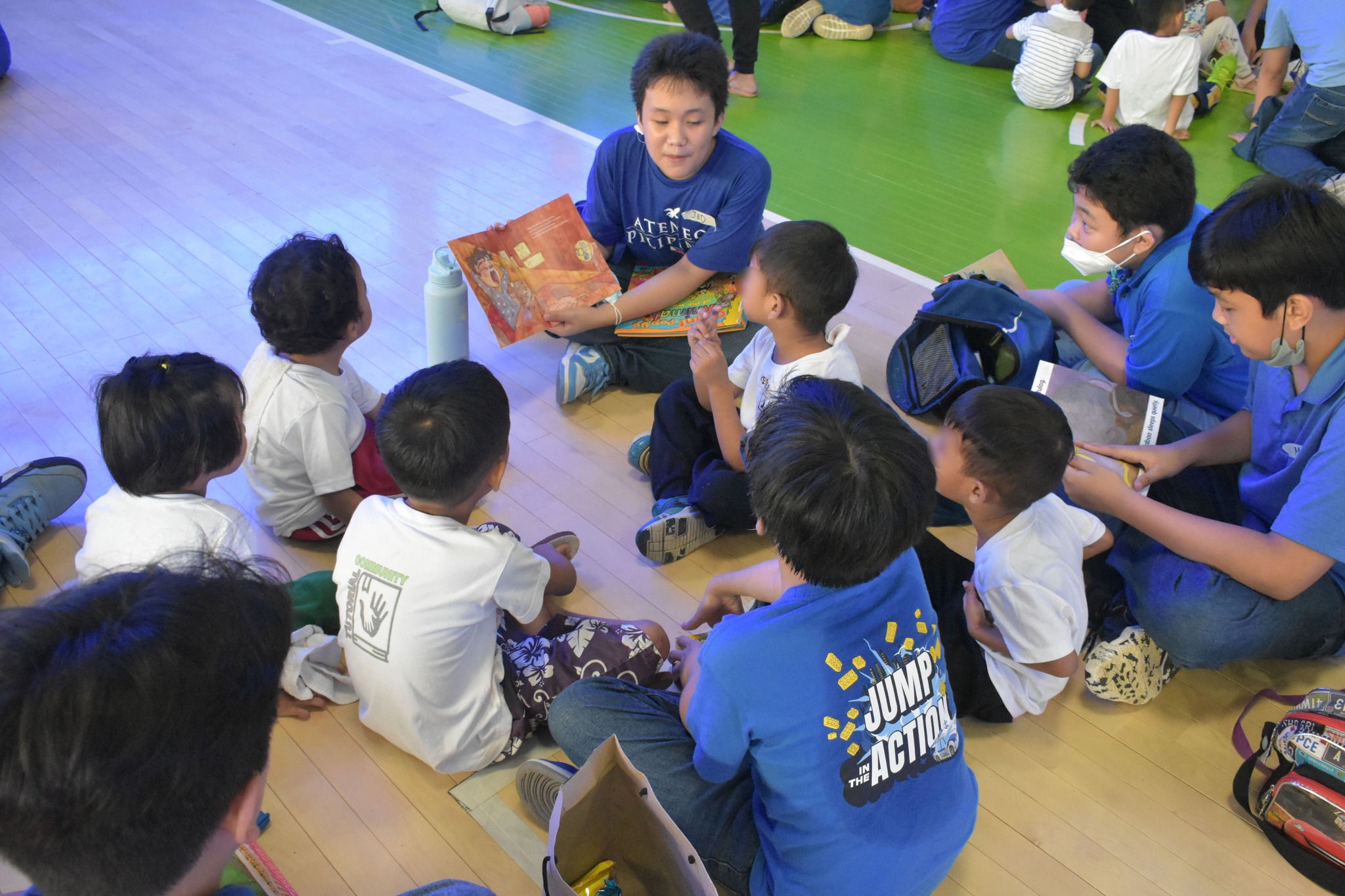 Boys from 7-Ashley during a storytelling session with children from another Day Care Center in Barangay Escopa 3