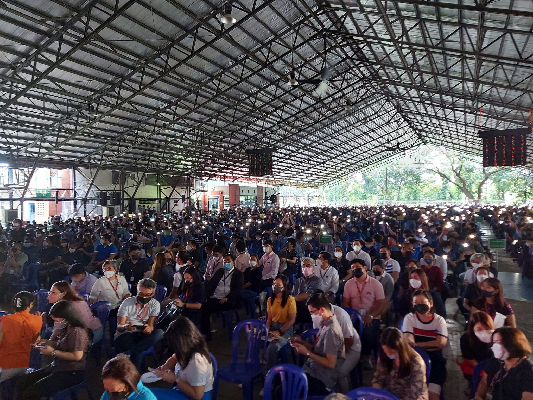 The boys light up their mobile phones as a show of gratitude to their formators.