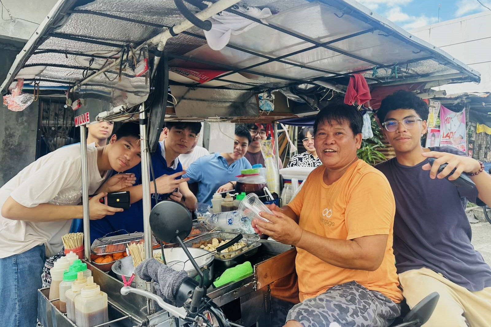 Realino boys with fishball vendor Kuya Willy 