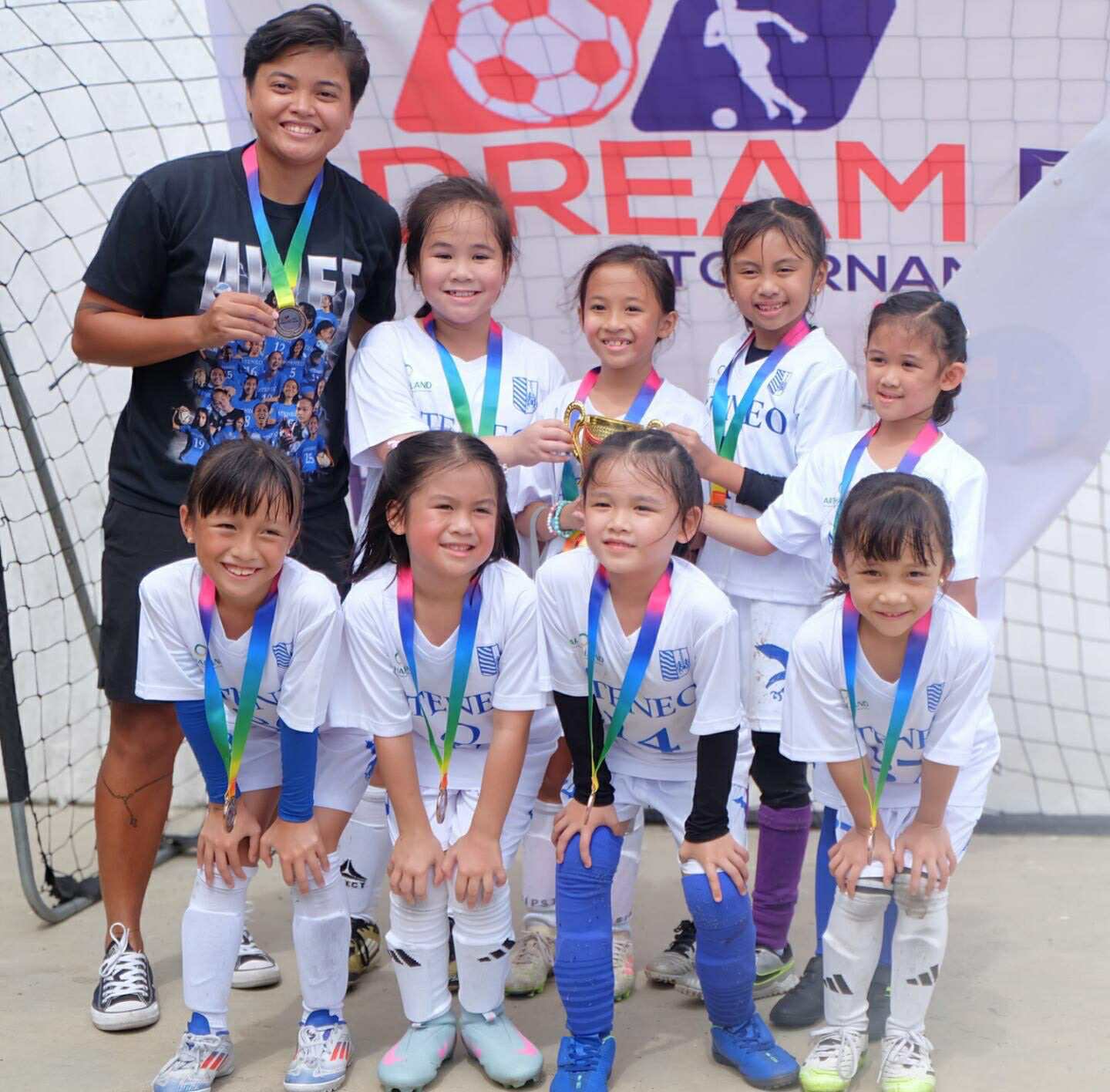 Front row from left: Tala Lorenzo, Charlie Dela Cruz, Lara Martinez, and Gabrielle Martinez; back row from left: Head Coach Joyce Semacio, Lexie Enerio, Anya Silva, Cassiegh Abad, Mia Sto. Domingo