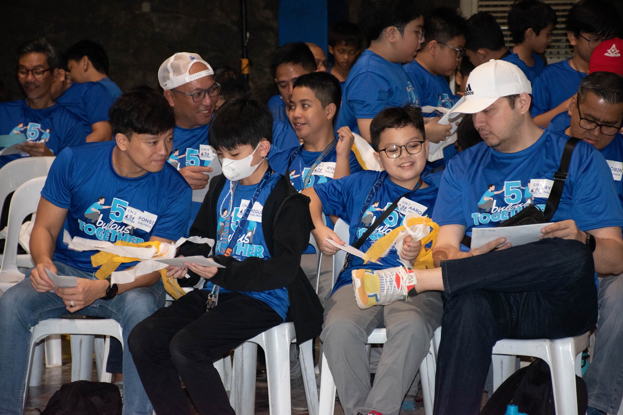 Dads and sons reading their letters to each other
